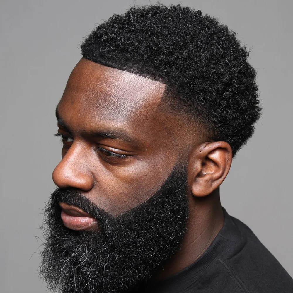 Fade haircut with full beard shape-up by a Brooklyn barber at Adrian Fanus Grooming