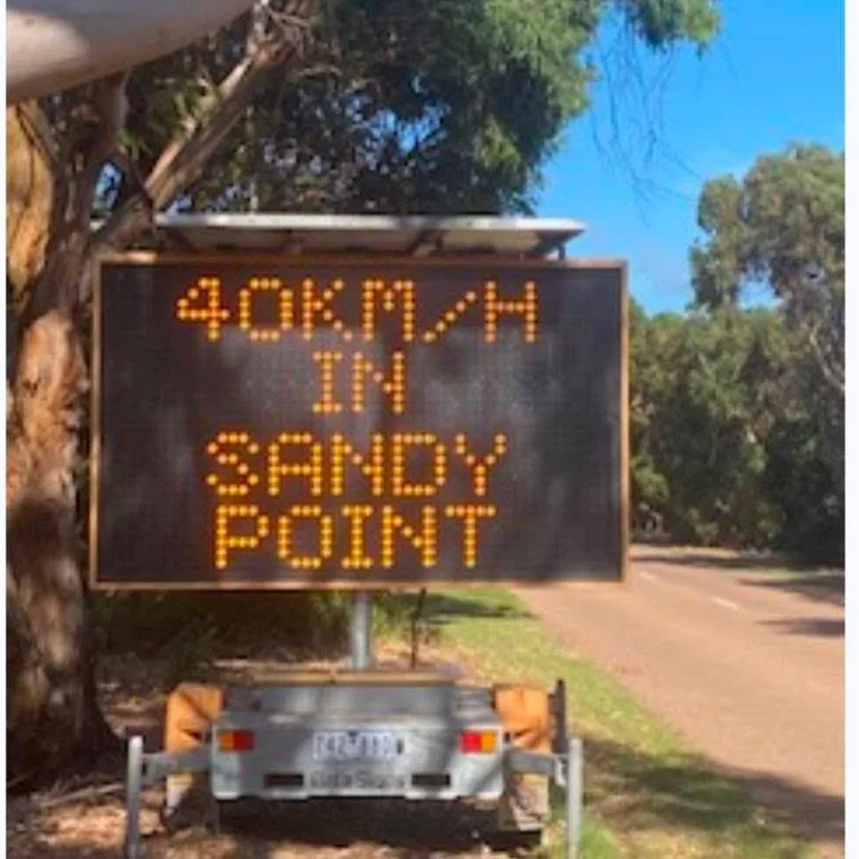 Visitors to Sandy Point are reminded of our 40km/h speed limit. Roads are shared with pedestrians, children, bikes, horses and wildlife. Cars must give way. After lobbying by SPCG to South Gippsland Council, this sign on Telopea Drive reminds drivers