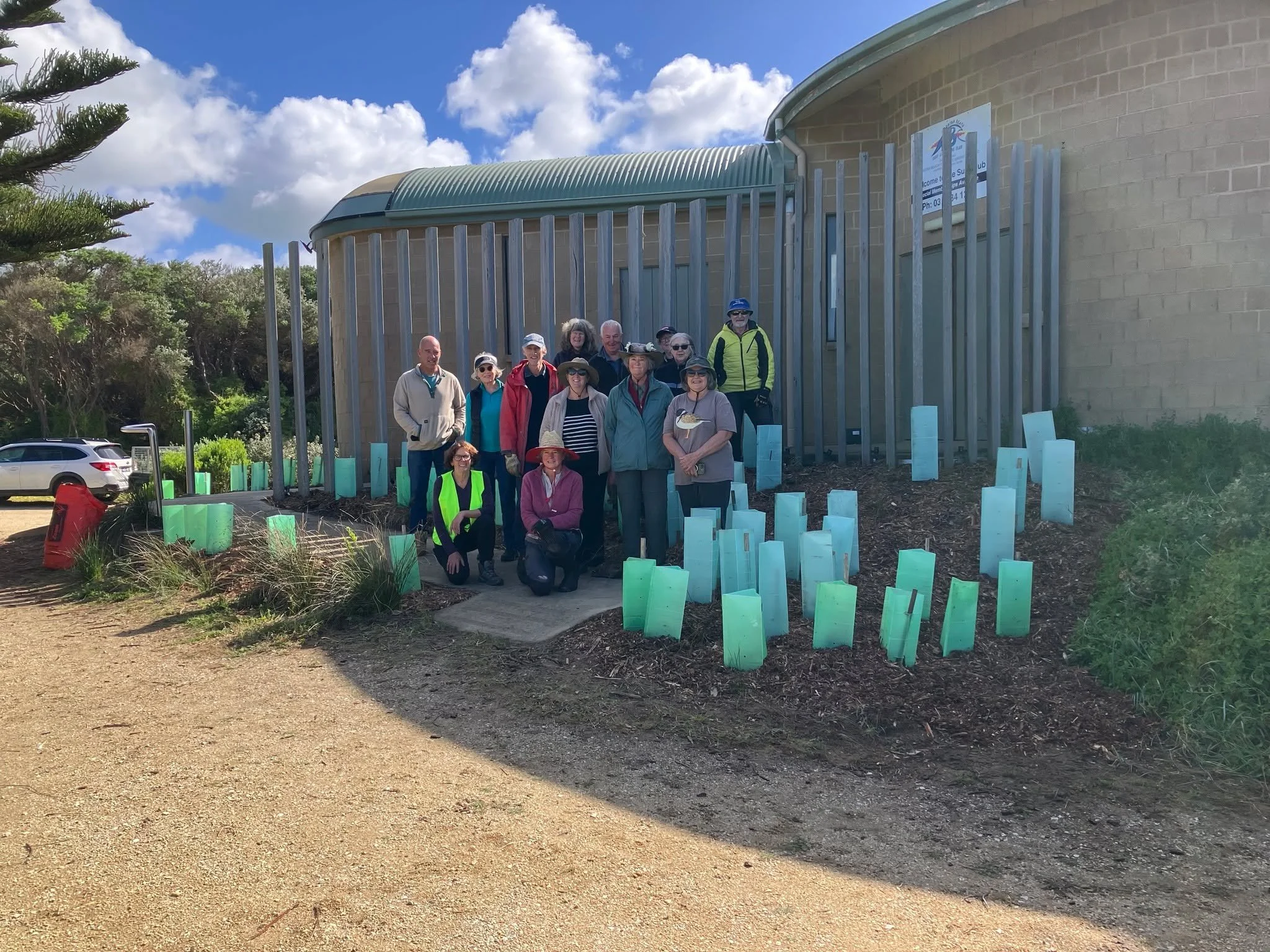 Planting at the Surf Club.
We are very happy to report we had a great turn up of volunteers keen to help plant out the entry area of the Surf Club and have attached a couple of photos. Many of the plants that we believe might be attractive to rabbits