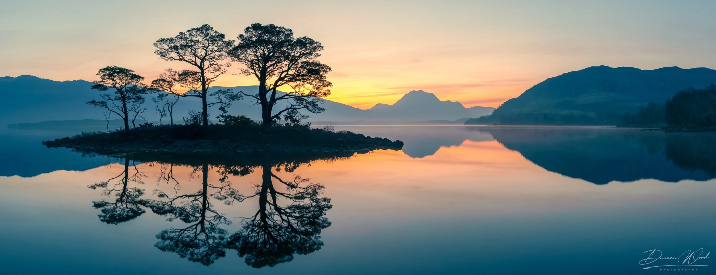 Level 3 advanced photography workshop in Scotland with atmospheric trees, loch reflections and refined Highland landscape composition