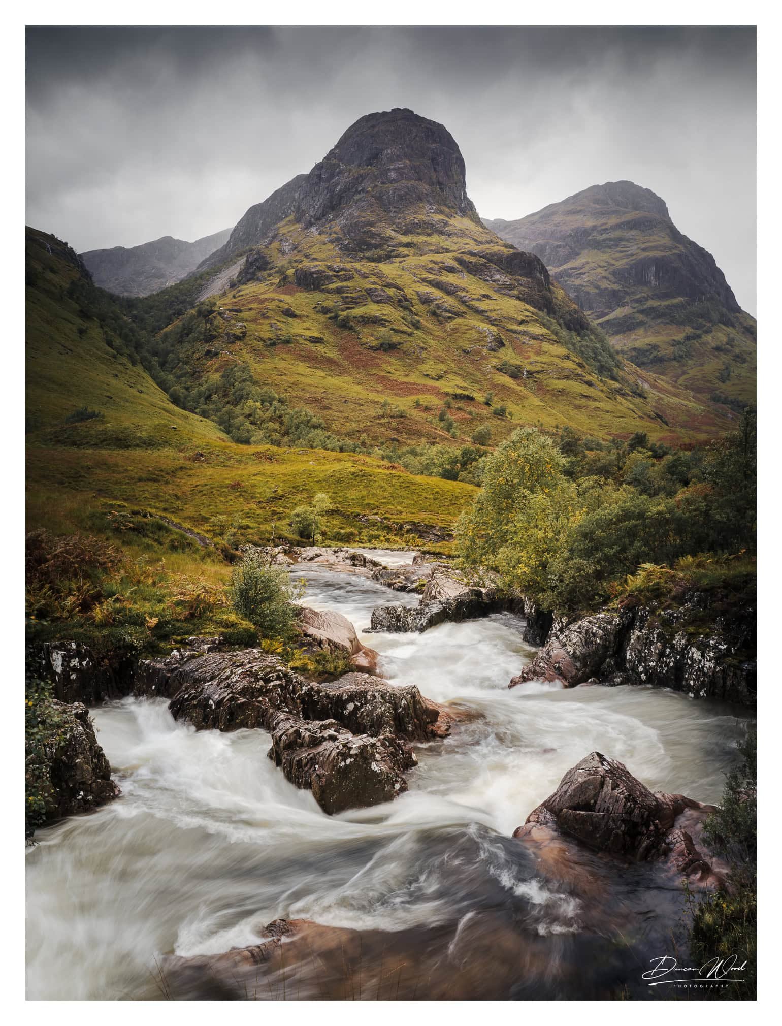 The Three Sisters and river in Glen Coe, photographed by Duncan Wood in Scotland. Scottish landscape photography.
