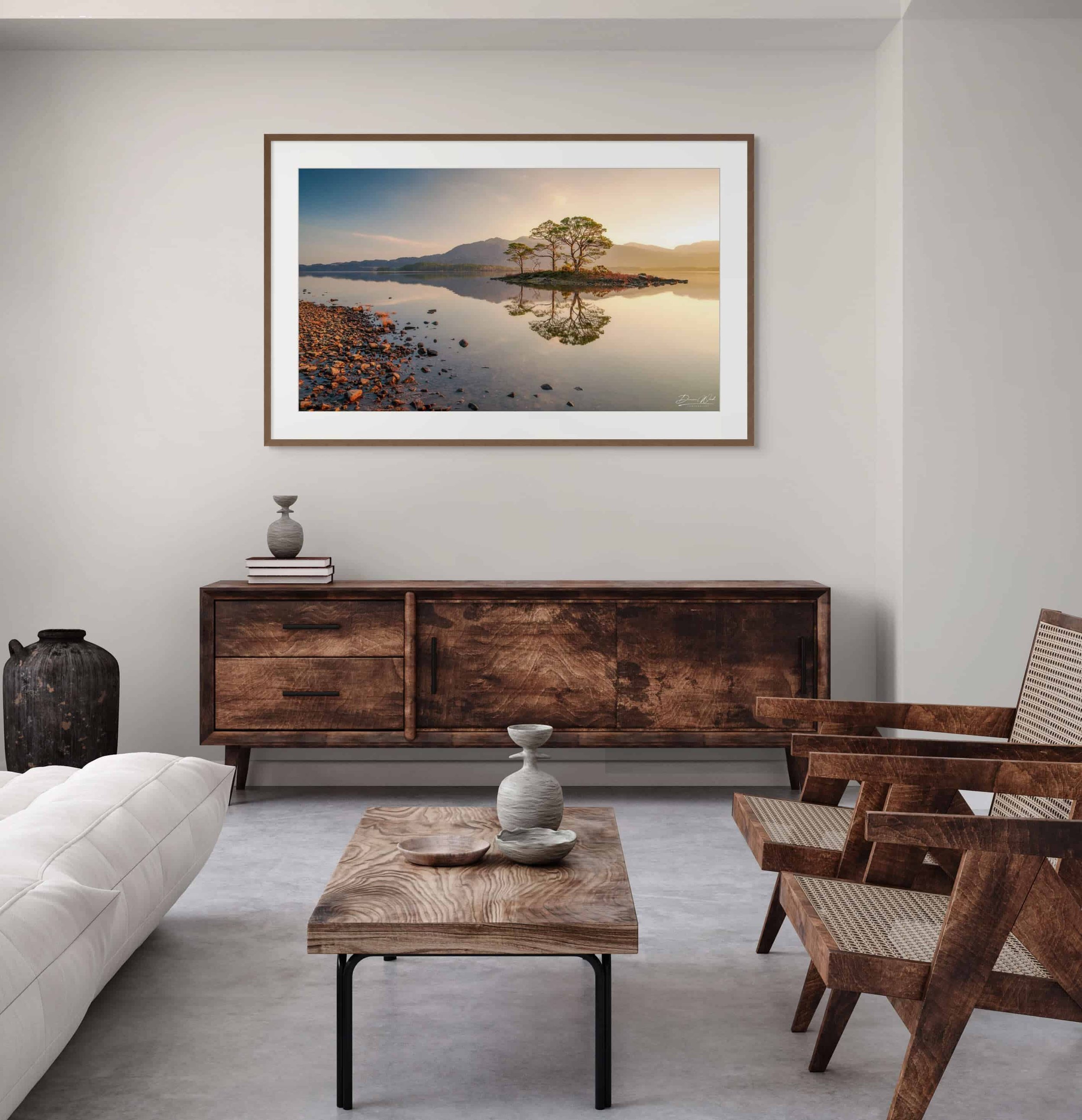 Framed print of The Golden Silence by Duncan Wood displayed on a wall. Scottish landscape photography showing sunrise at Loch Maree.