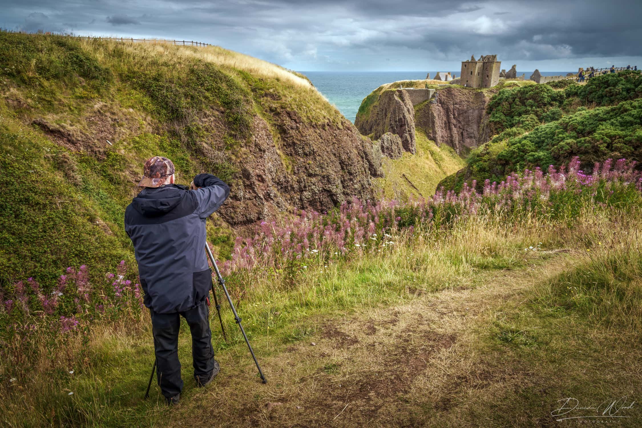 Returning workshop client photographing Dunnottar Castle and the East Coast of Scotland