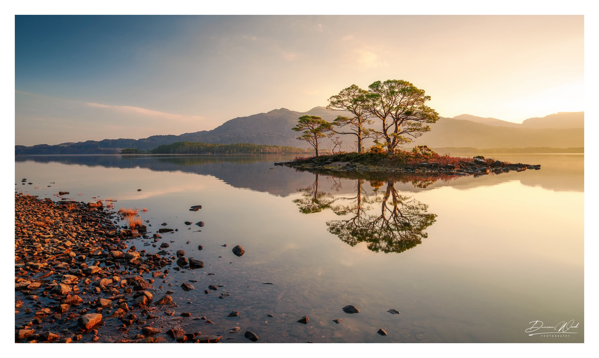 Sunrise on Loch Maree island, photographed by Duncan Wood in Scotland. Scottish landscape photography.