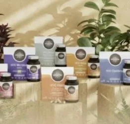 Mountain range with grassy hills and a blue lake under a cloudy sky.  Sarah Eglin - Cancer Nutritionist - Anticancer Living.