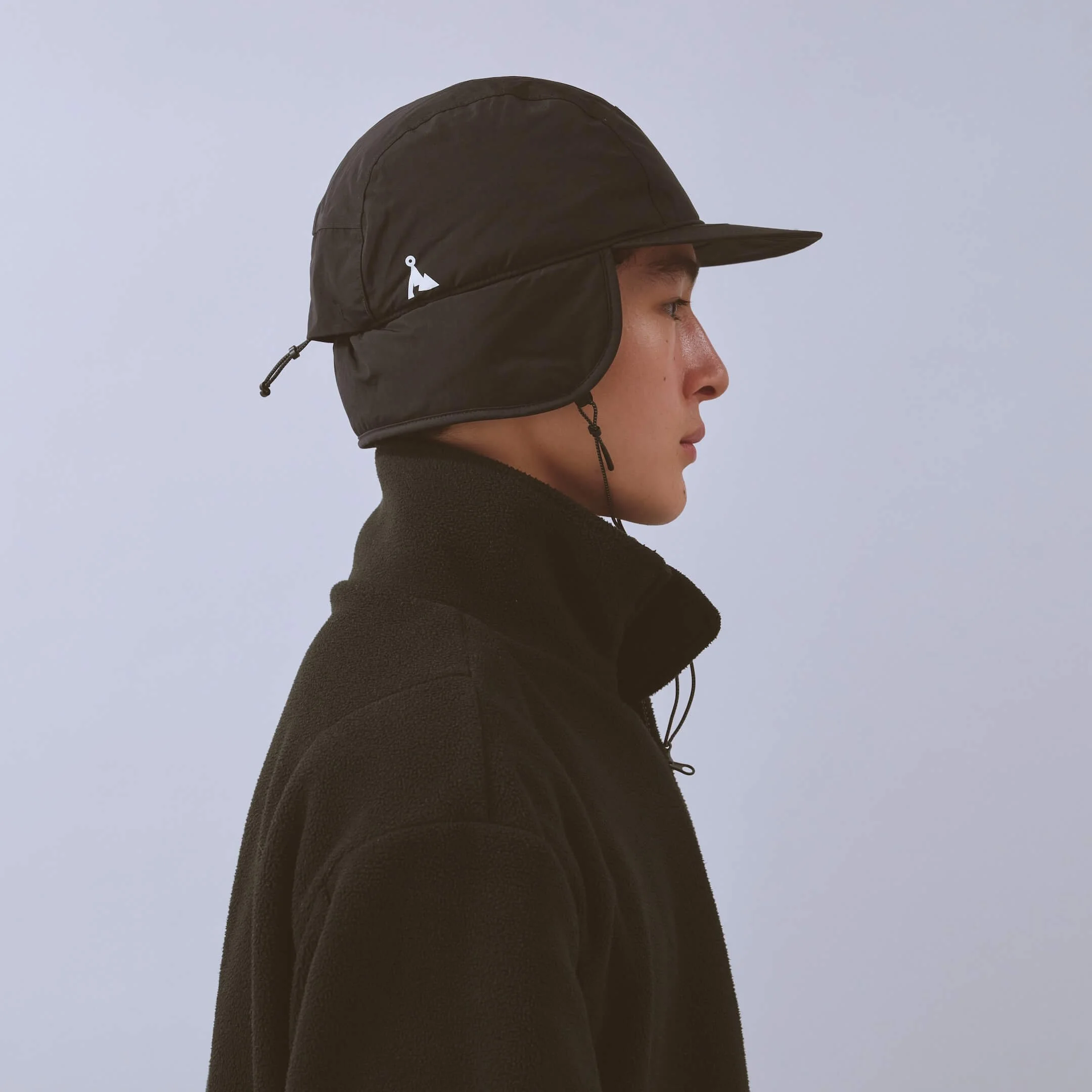 vaga-padded-hiker-cap-black-model-profile.jpg