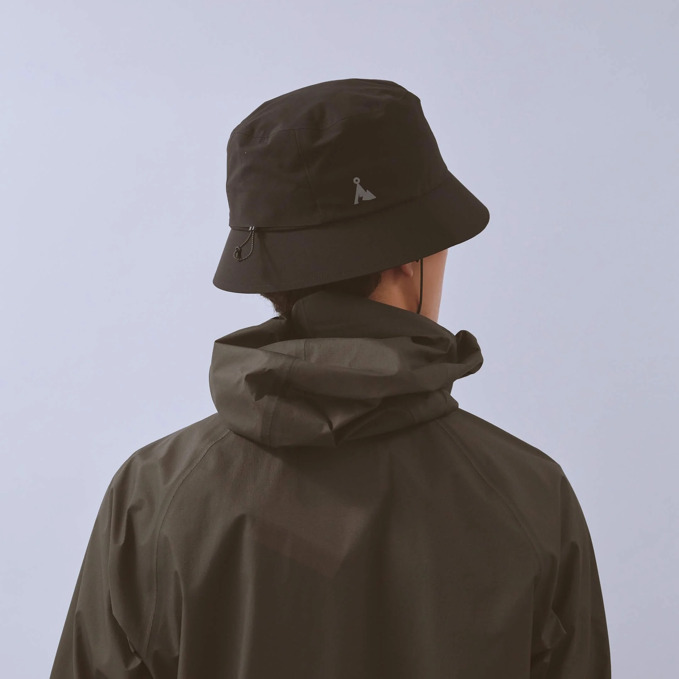 vaga-waterproof-bucket-hat-black-model-back-angle.jpg