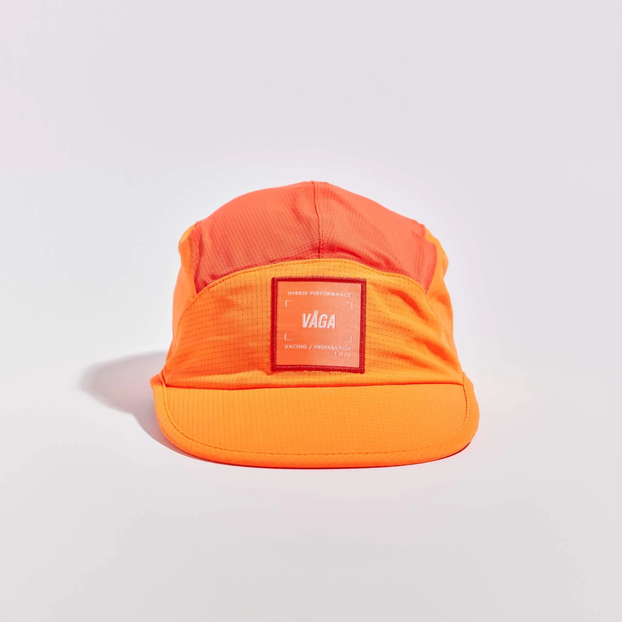 vaga-transit-lite-cap-unstructured-running-cap-neonorange-coral-front.jpg