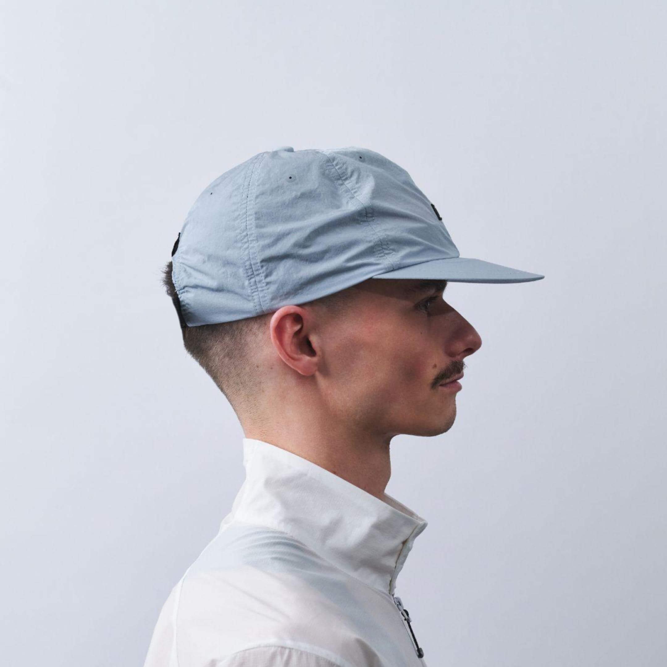 vaga-drift-cap-running-cap-postalblue-model-side-profile.jpg