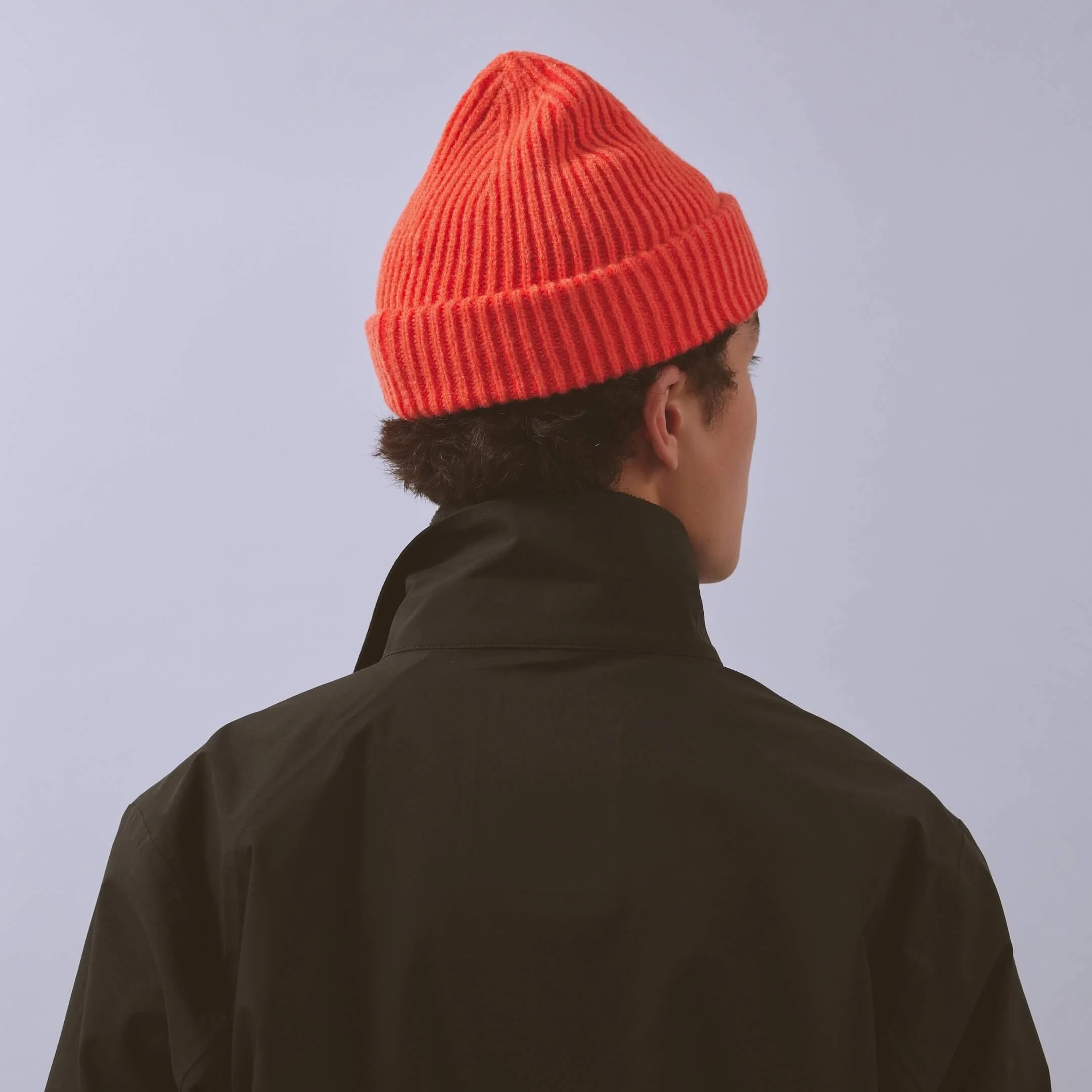 vaga-midweight-running-beanie-neonpeach-flamered-model-back-angle.jpg