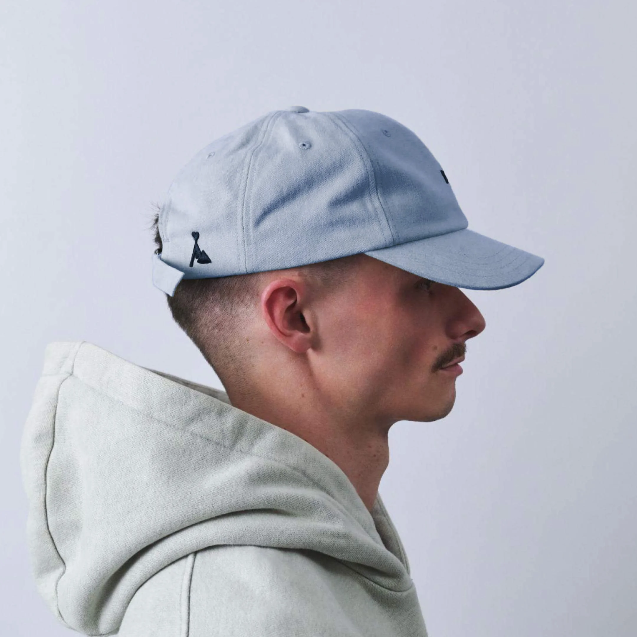 vaga-washed-cotton-cap-postalblue-model-profile.jpg