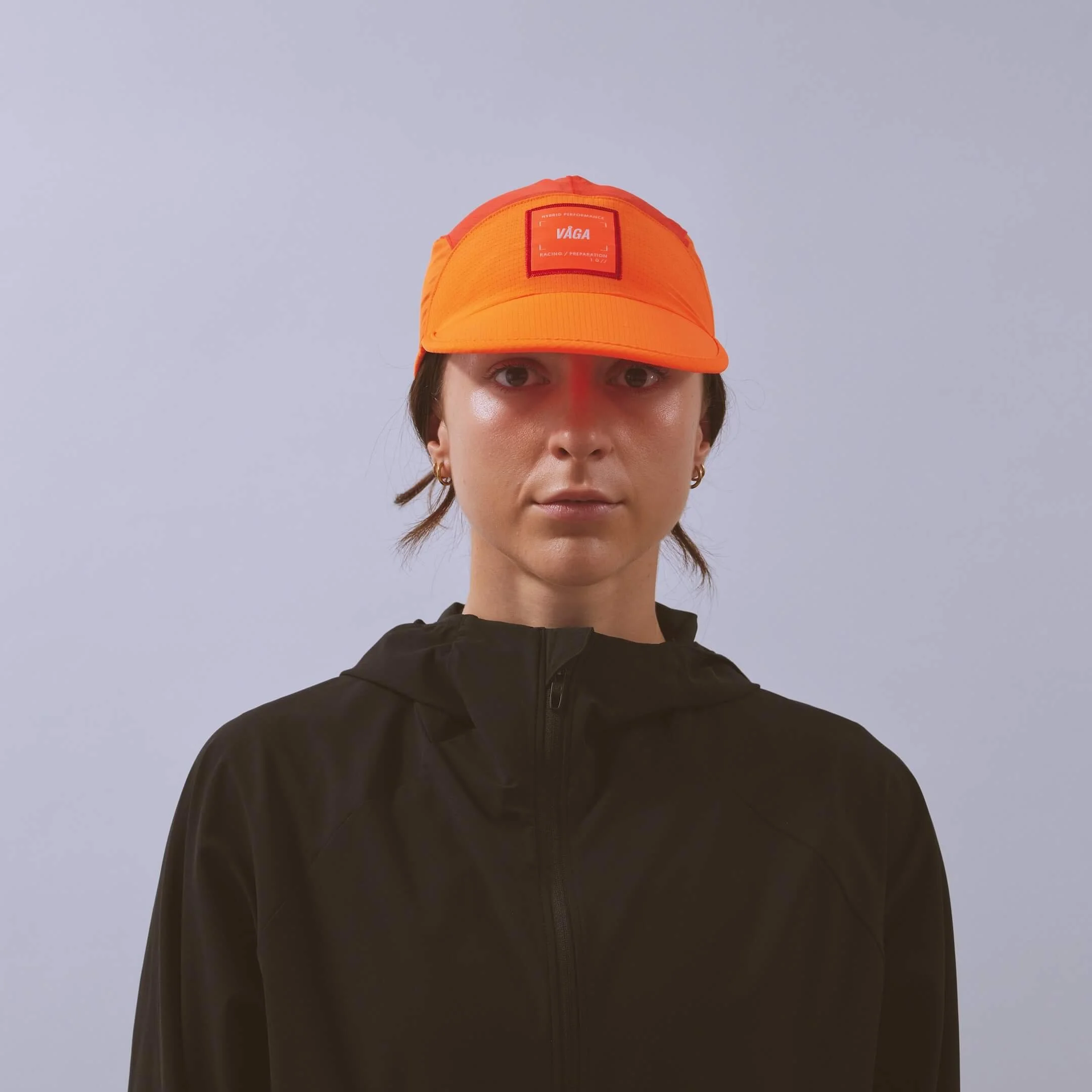 vaga-transit-lite-cap-unstructured-running-cap-neonorange-coral-model-front.jpg