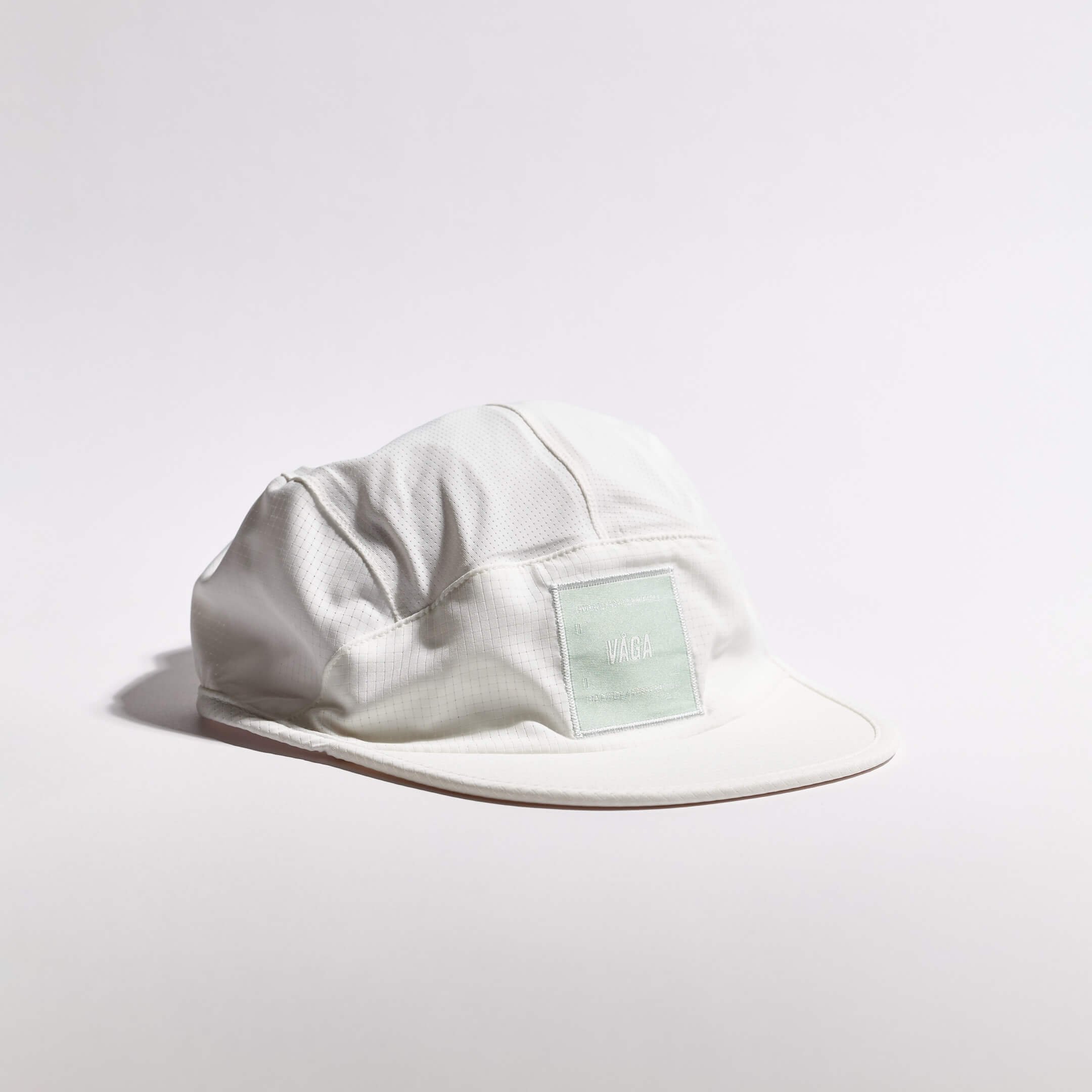 vaga-transit-lite-cap-unstructured-running-cap-white-angle.jpg