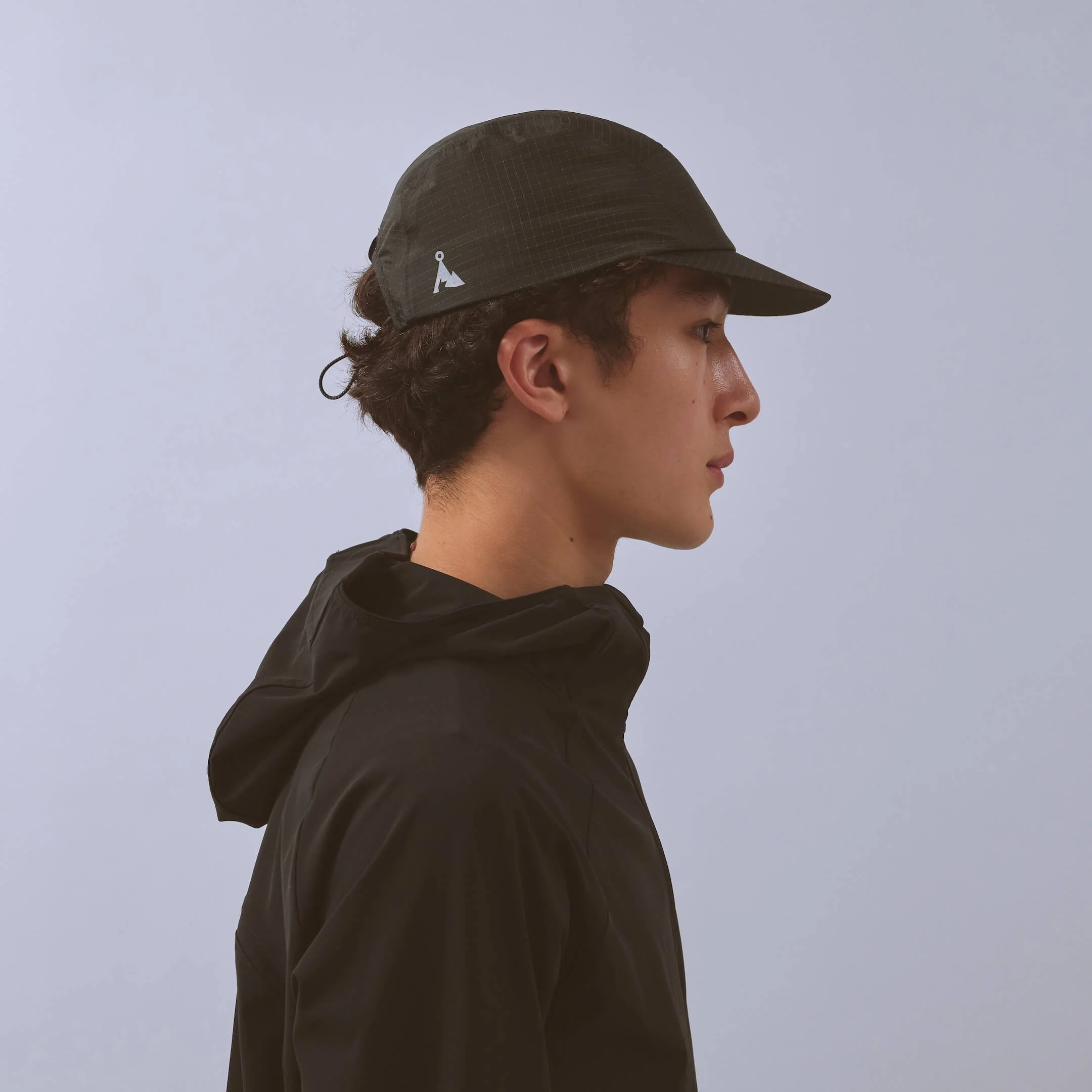 vaga-night-club-running-cap-black-model-profile.jpg