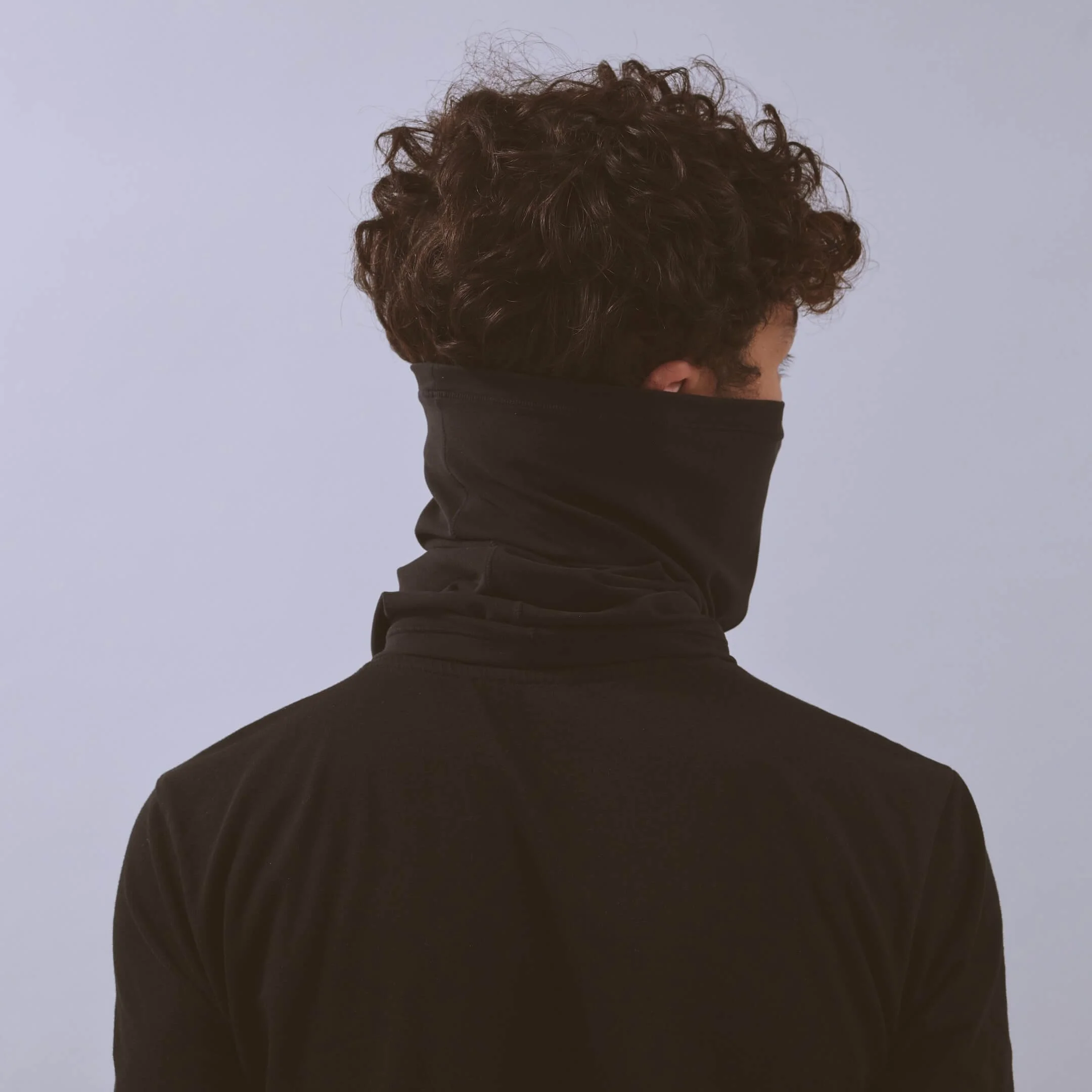 vaga-jersey-midweight-neck-gaiter-black-model-back-angle.jpg
