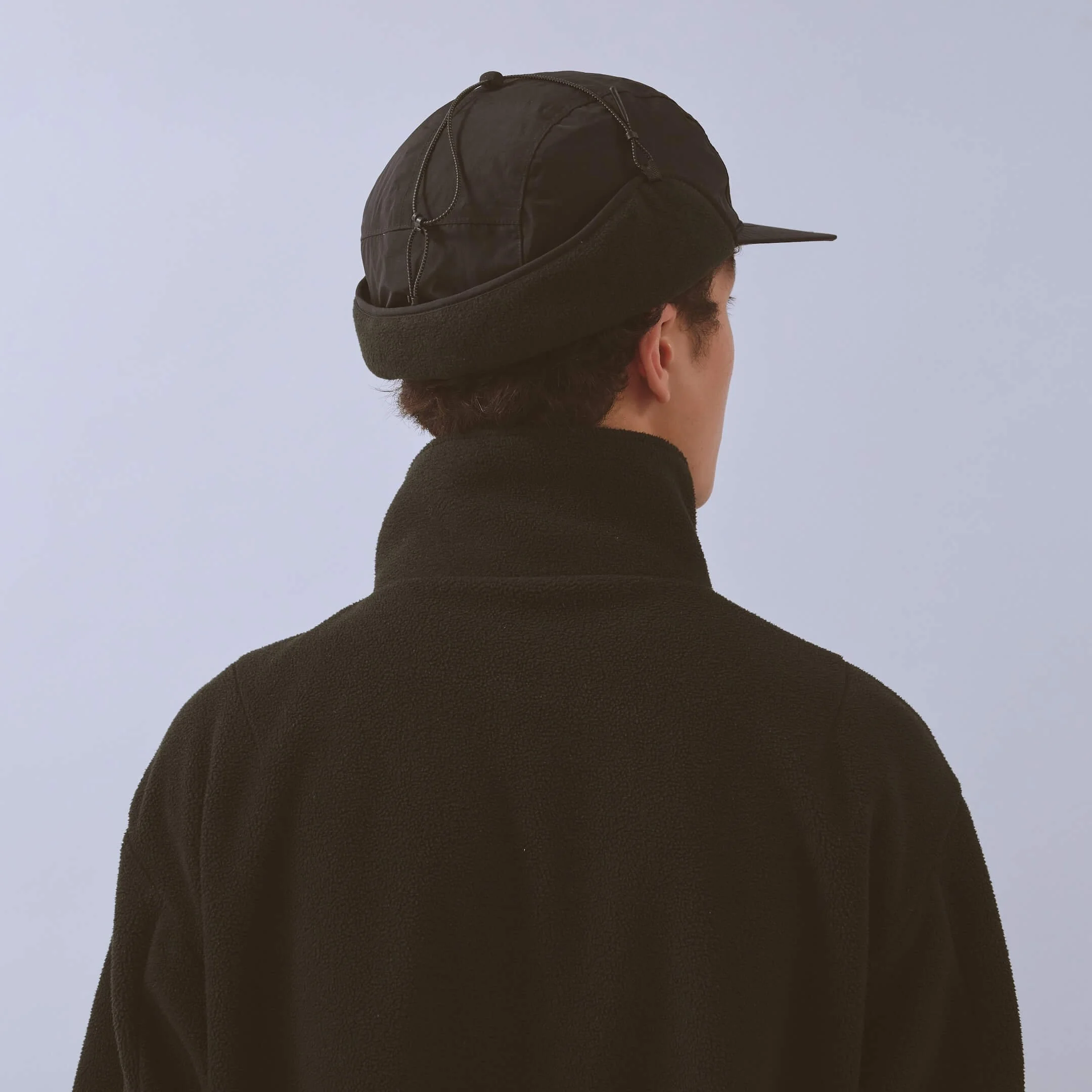 vaga-padded-hiker-cap-black-model-back-angle-up.jpg