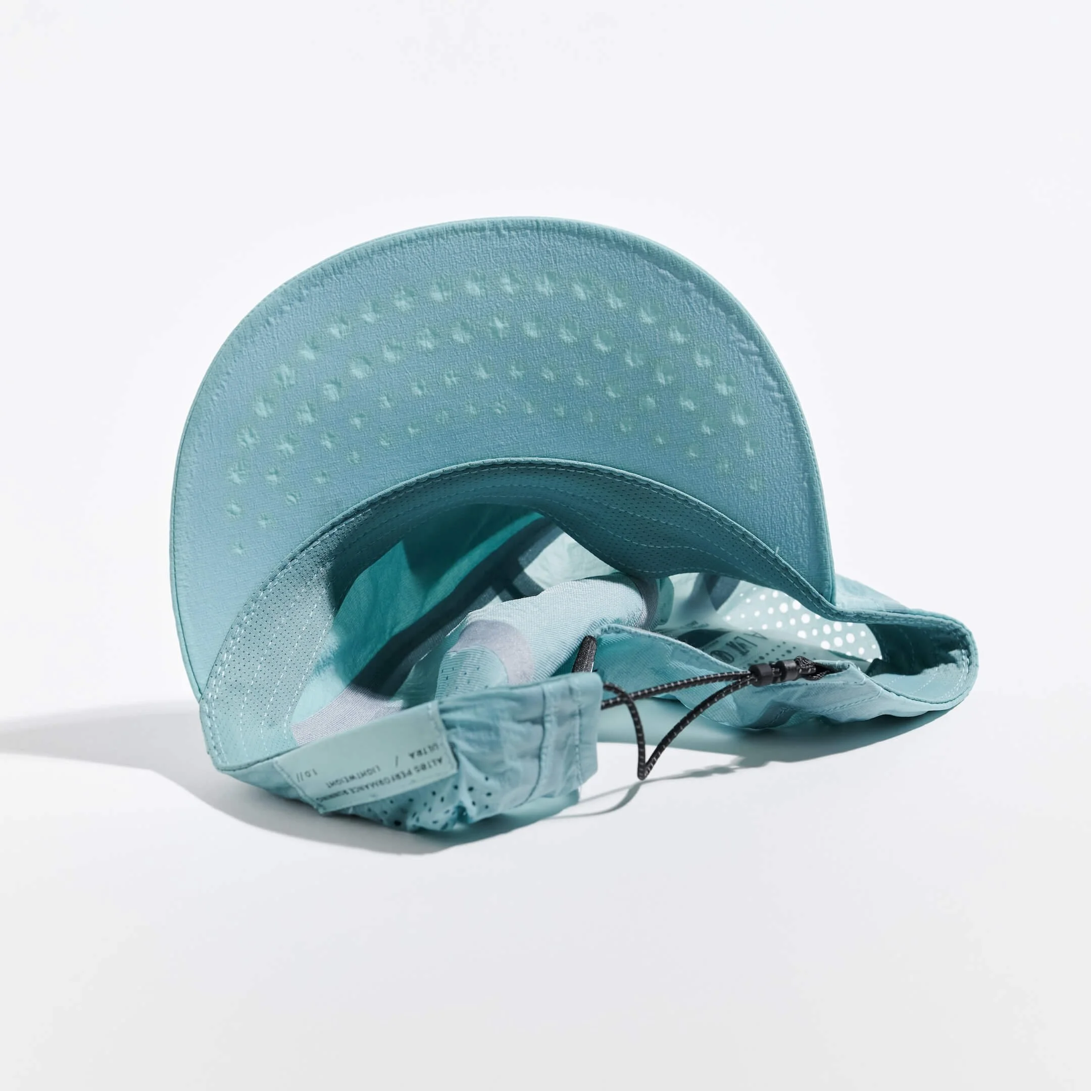 VAGA ALTOS Running Cap in Teal Underneath.jpg