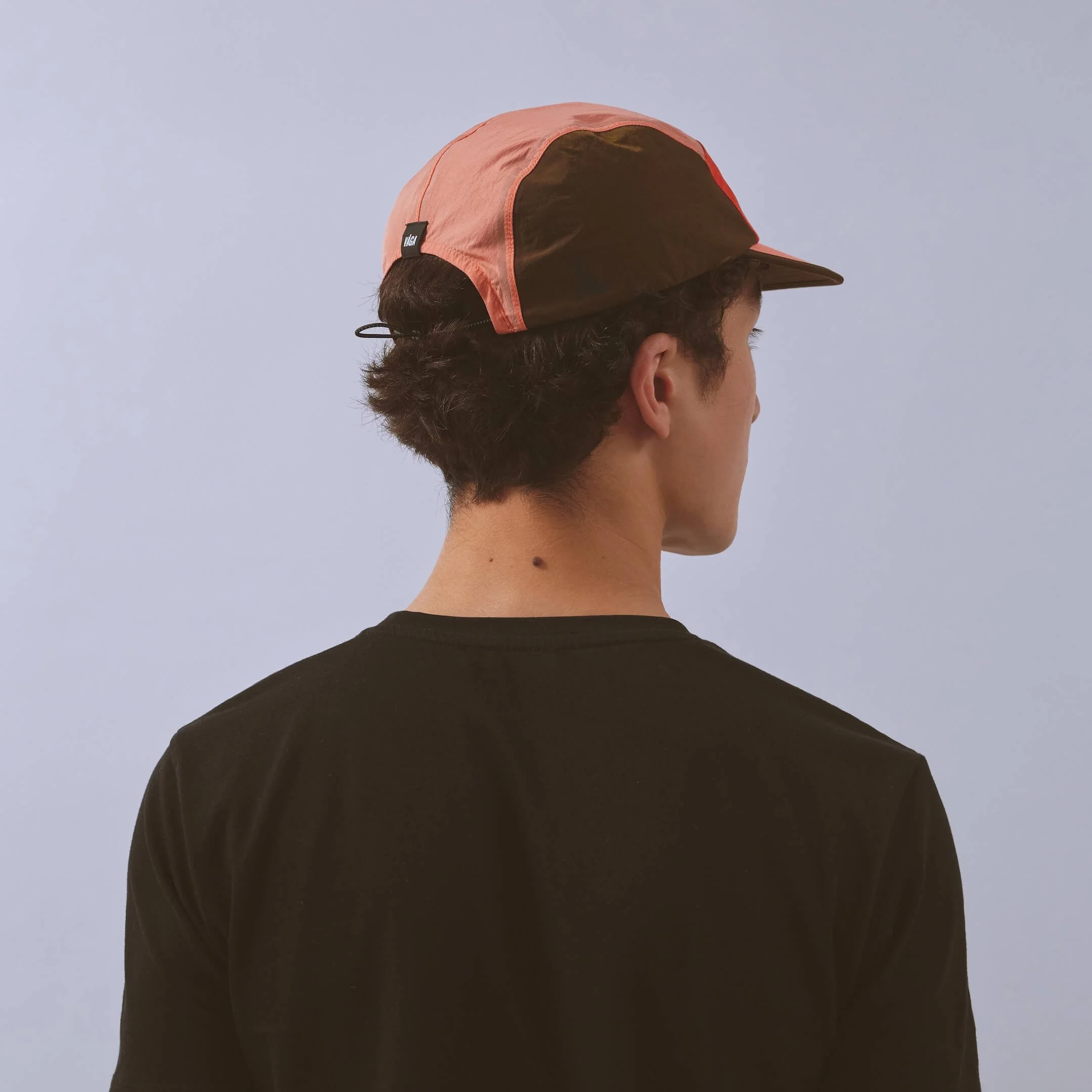 vaga-pacer-running-cap-flamered-coral-brown-model-back-angle.jpg