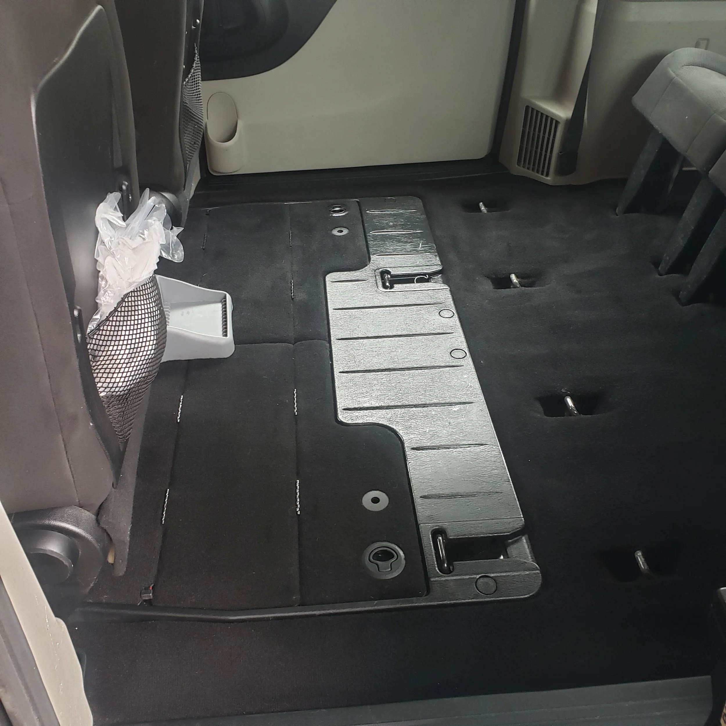 van interior after receiving a full interior including carpet shampoo, dog hair removal, and steam cleaning.