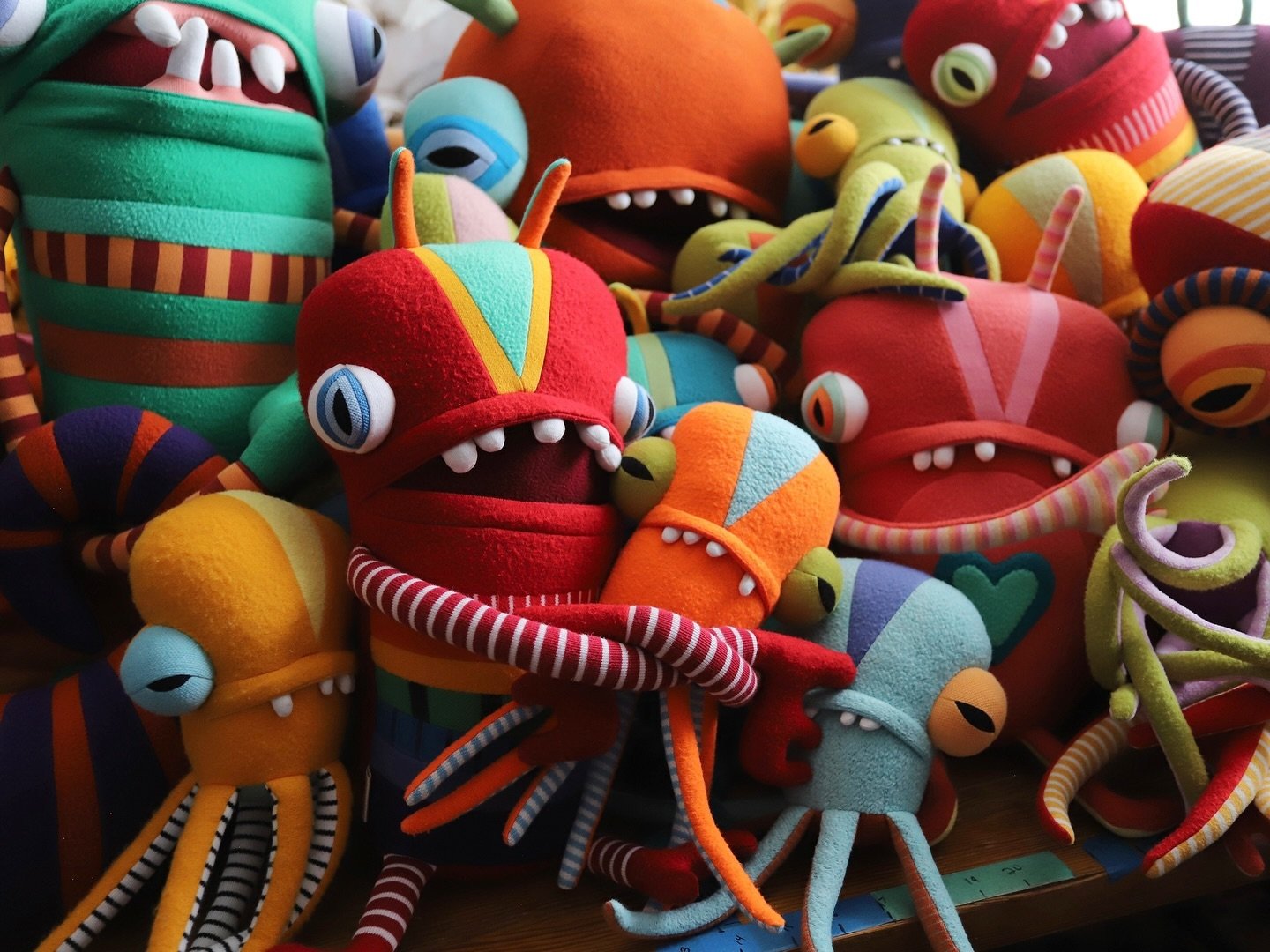 &hearts;️🧡💛 pile up on my work table&hellip;hoping to have these buds (and some special halloweeny ones too) ready for a shop update in the next couple weeks 🤞
.
.
.
.
. 
#cottonmonster #textileart #fiberart #upcycled #recycled #cottonmonsters #ha