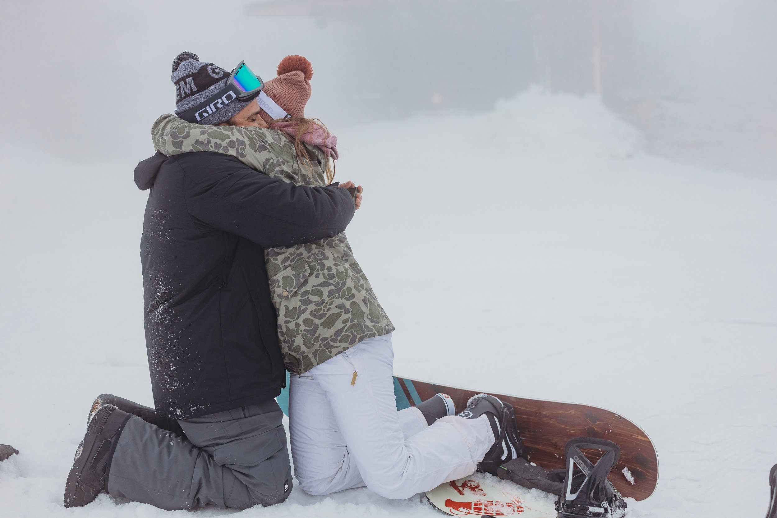 Liz Masi Photo, a Poconos wedding and engagement photographer, captures a ski proposal at Camelback Mountain.