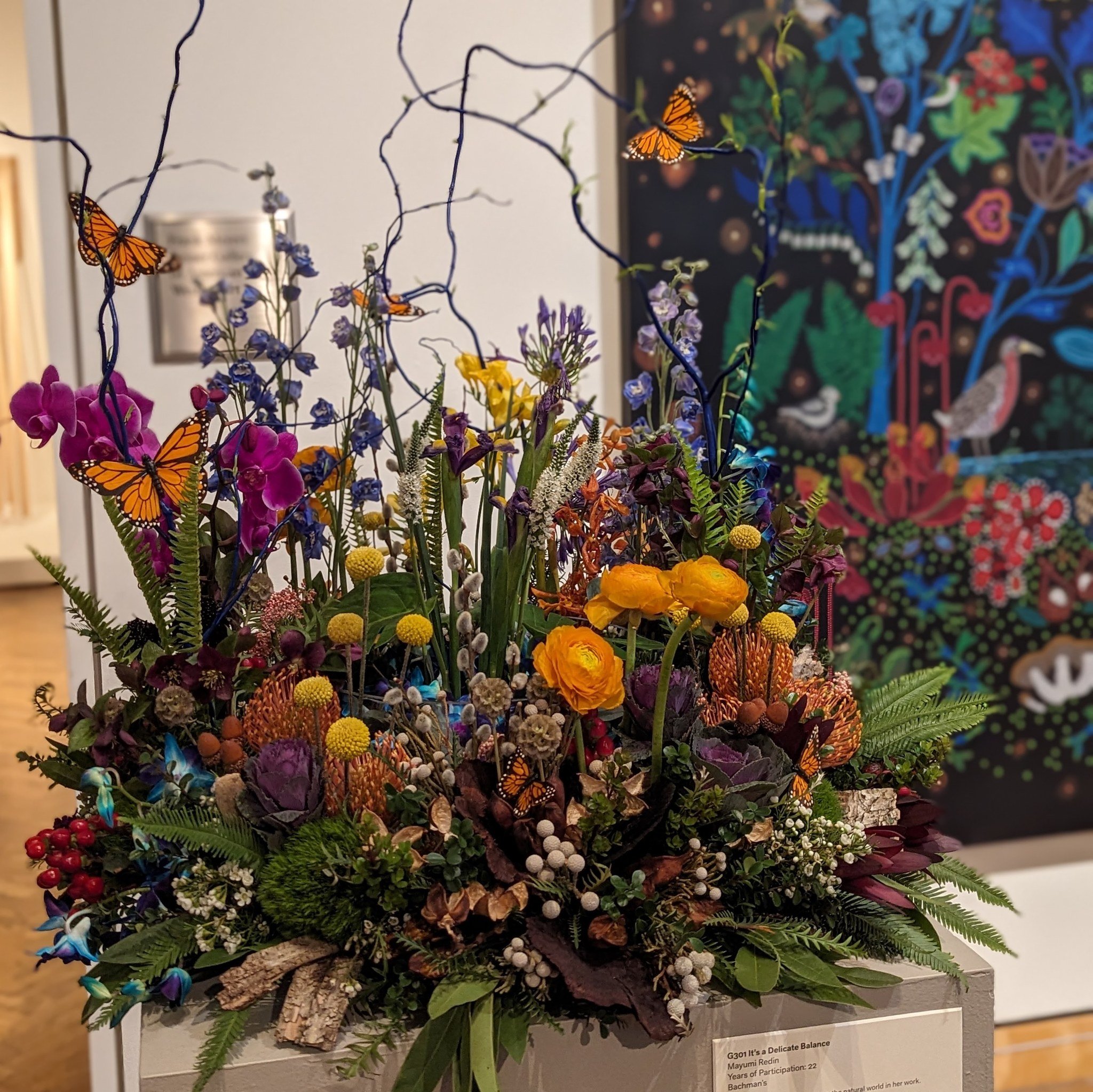 Art in Bloom at MIA did not disappoint yesterday. My friend and I joined a mass of humanity, all enjoying the display of art and the flower arrangements they inspired. Waiting for my friend outside the gift shop, my heart thrilled at the throngs of p