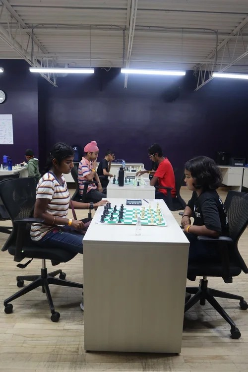  Children playing in a chess tournament hosted by EnRoute 2 Success. 