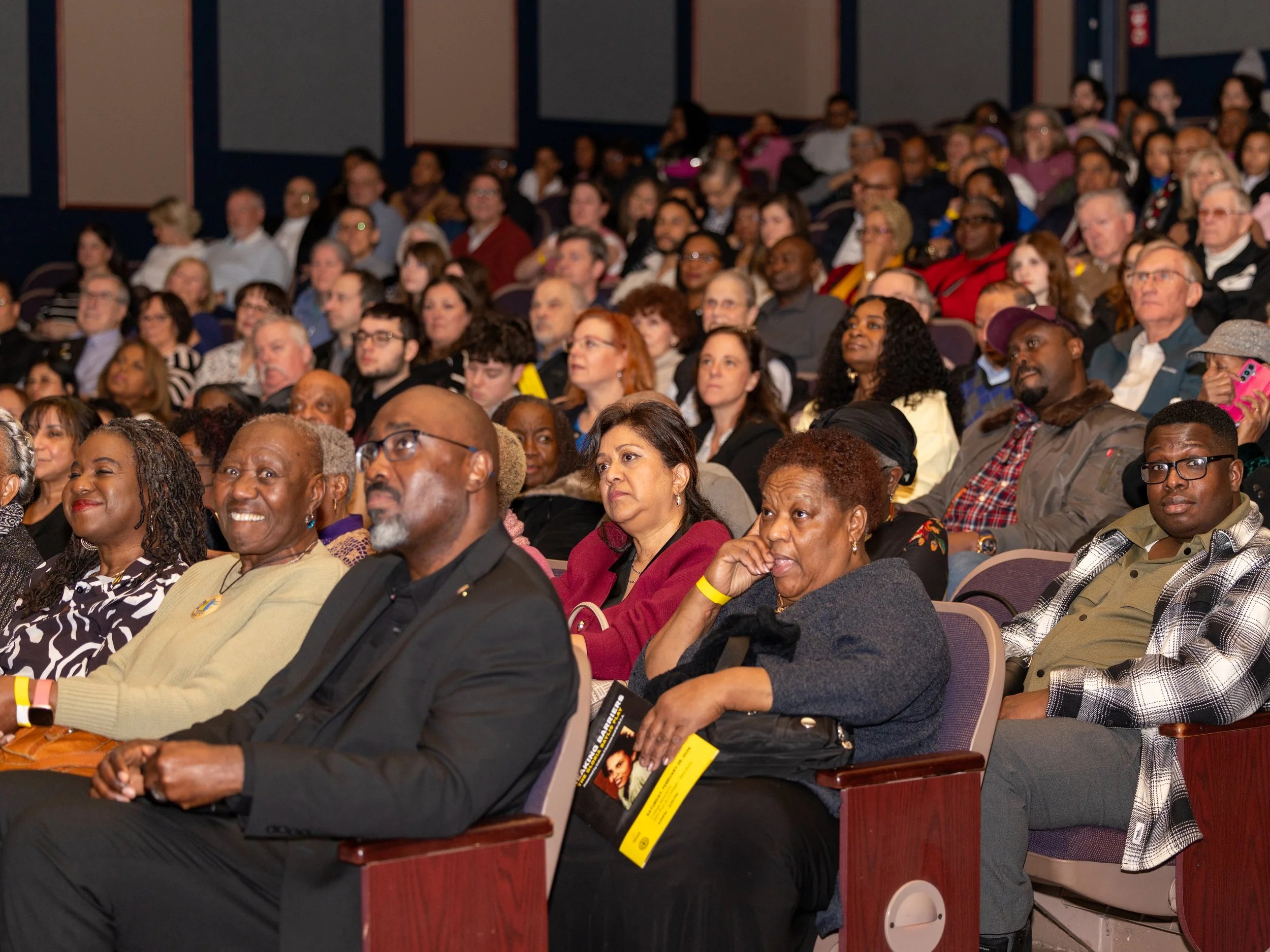 Audience members watching the Breaking Barriers: The Story of Gloria Baylis stage production