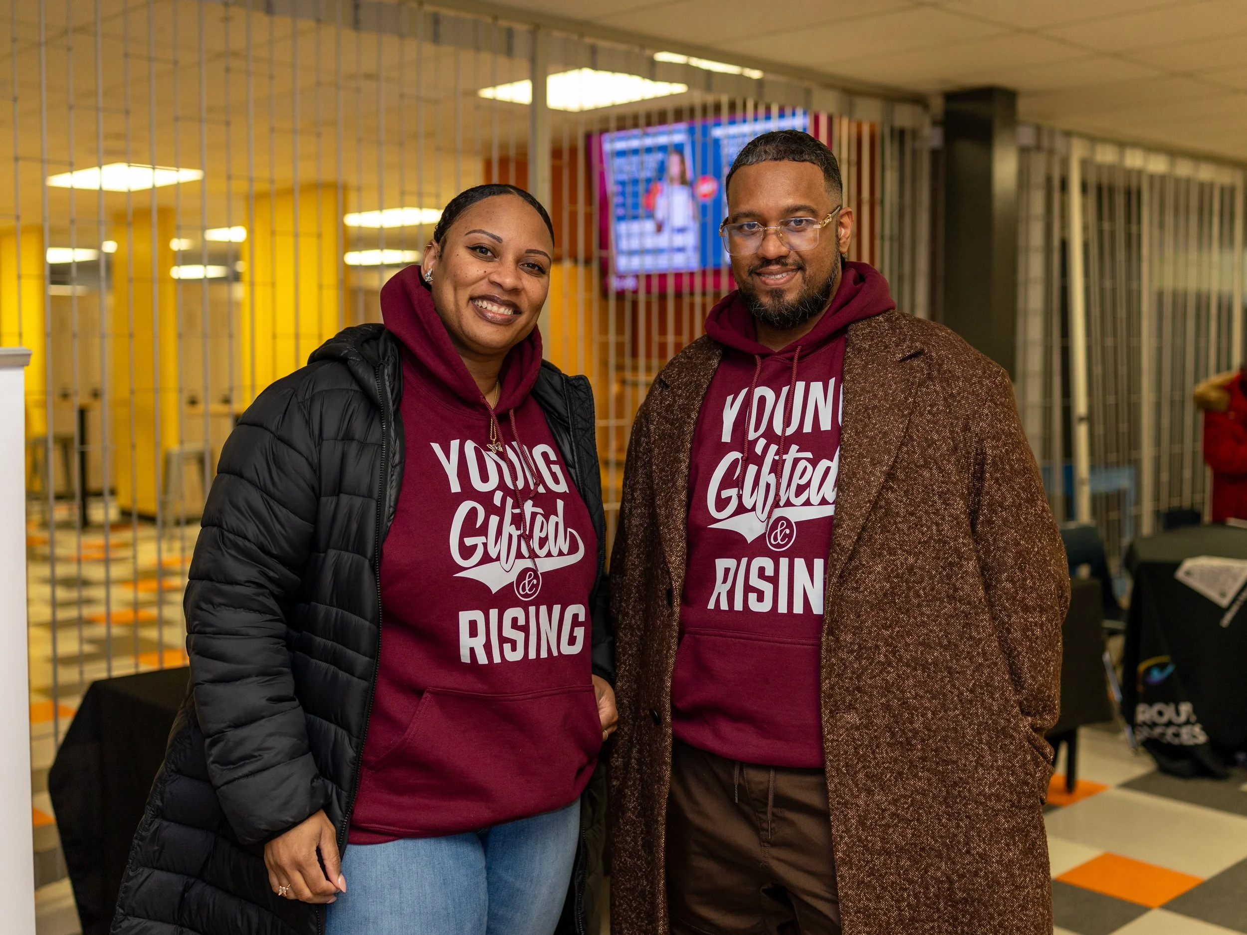 Attendees wearing Young Gifted and Rising hoodies at Breaking Barriers community event
