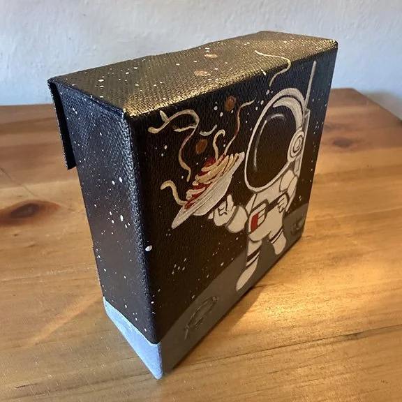 18-Astronaut Eating Spaghetti in Space Side.jpg