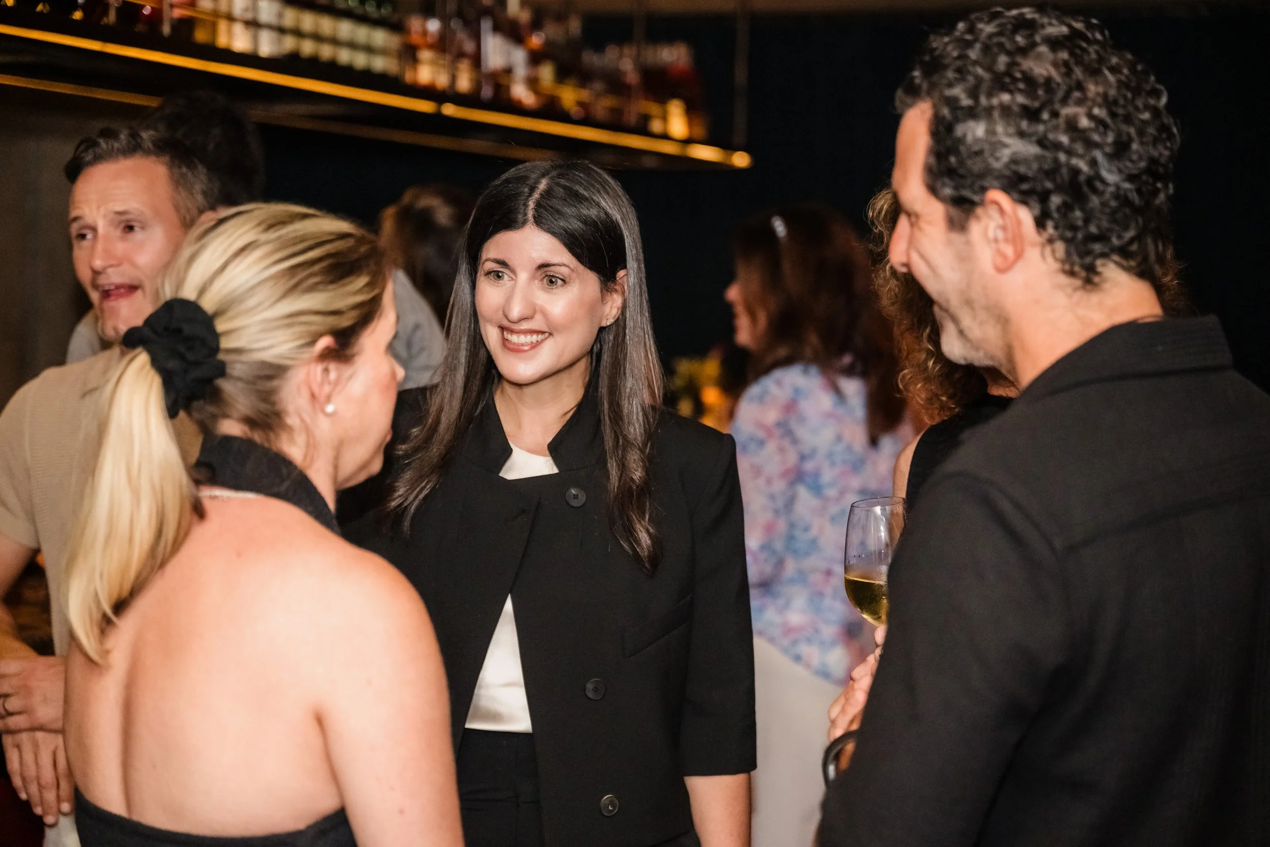Keren Eldad talking with guests at the Harbour Club Miami Beach book launch event for Gilt Free.