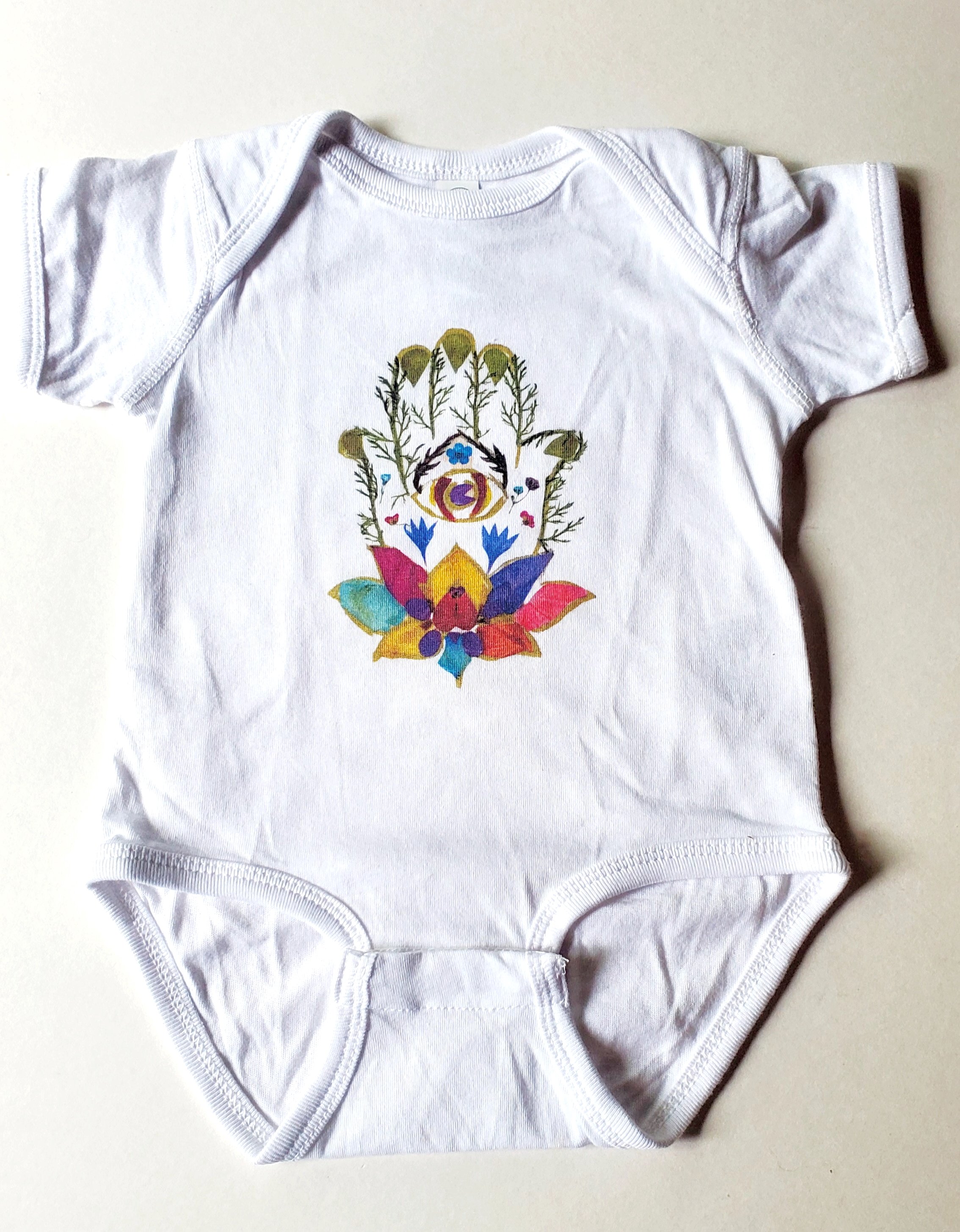 Hamsa hand onesie.jpeg