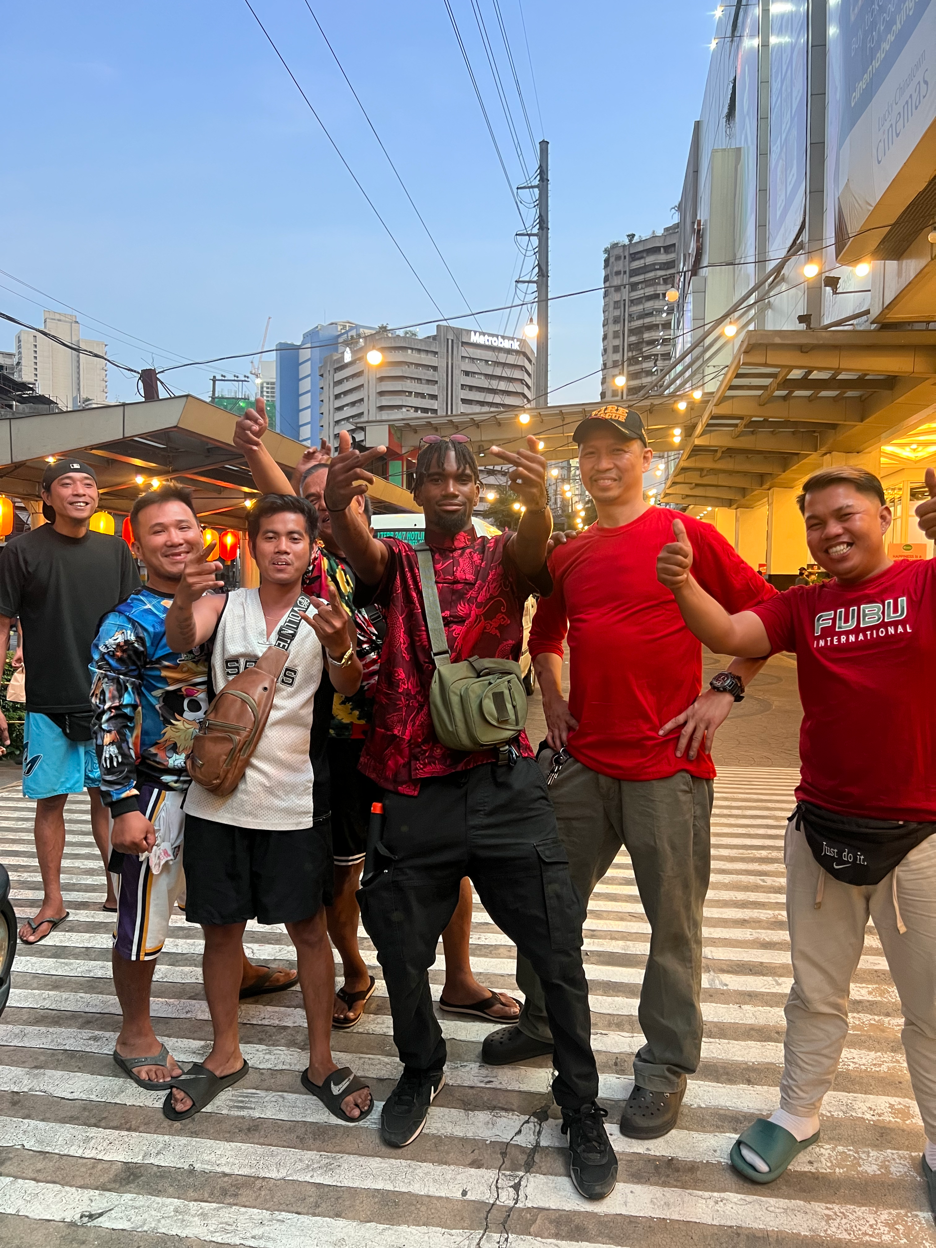 Upthatpoletom taking pics with random people while shooting a music video in Manila 