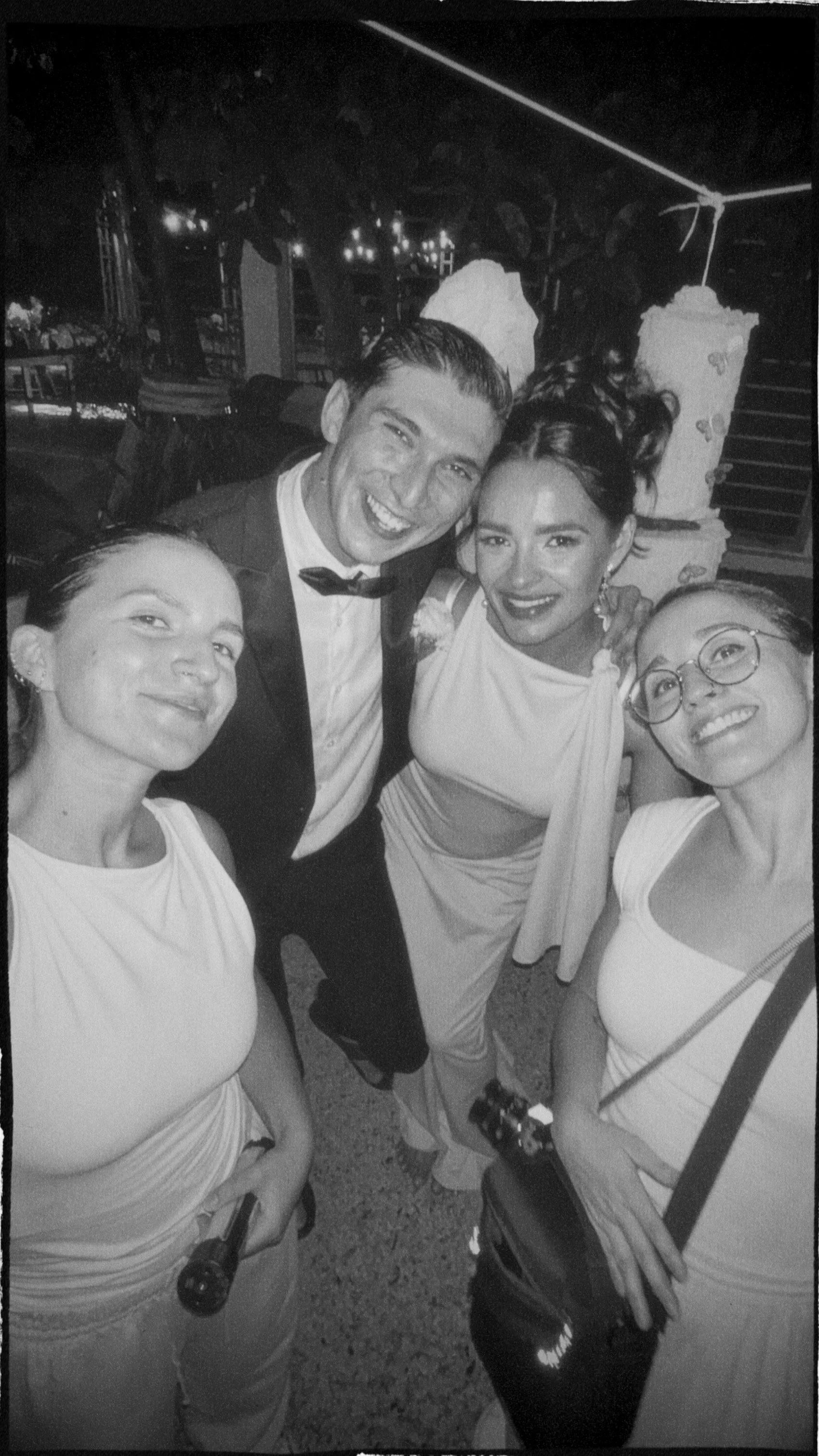 black and white photo of Emmedelmar with clients at their wedding in Cozumel, Mexico.