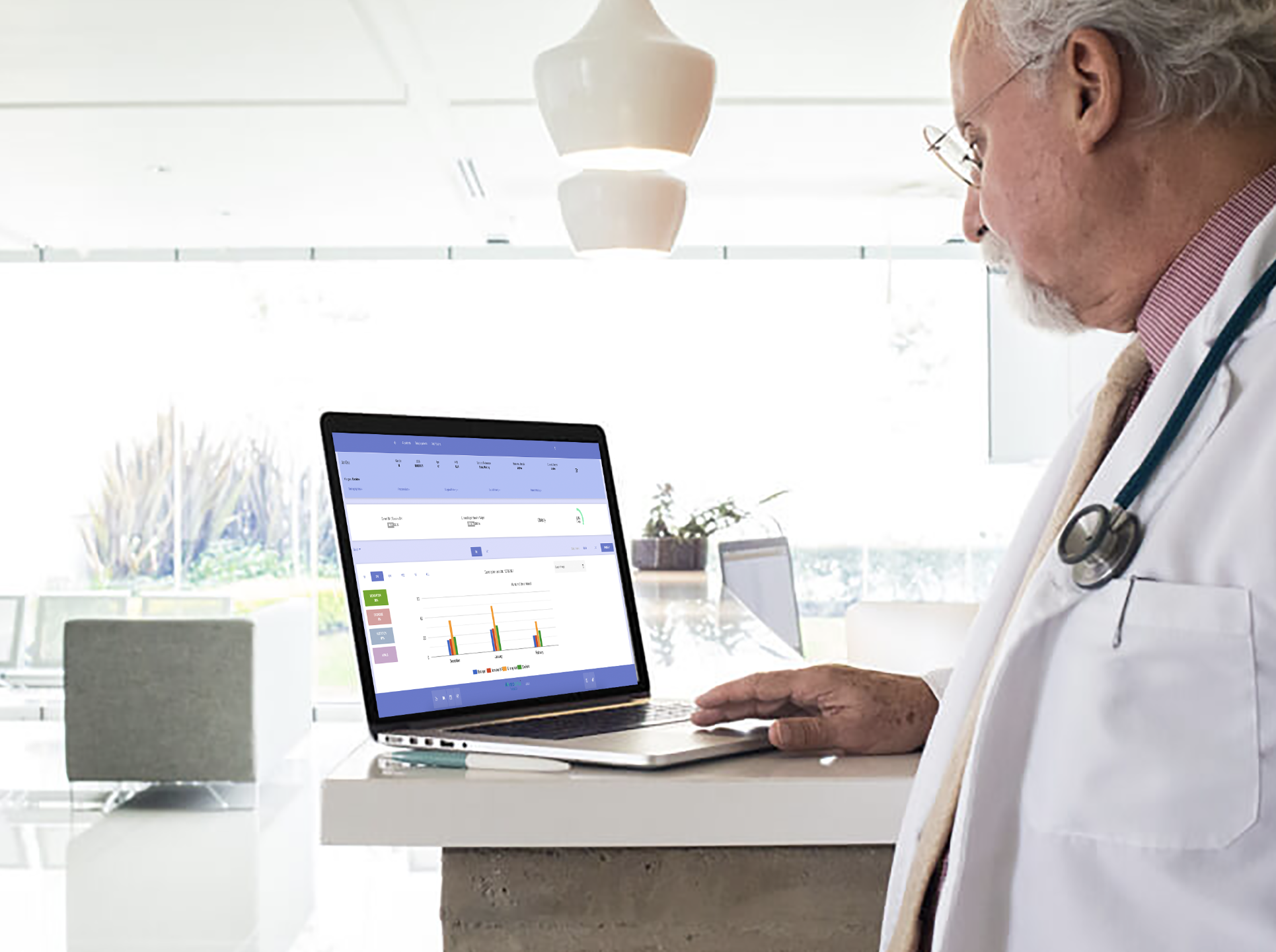 Doctor reviewing patient data and analytics on a laptop, showcasing Mobrise Health's advanced healthcare technology solutions for data-driven decision-making.