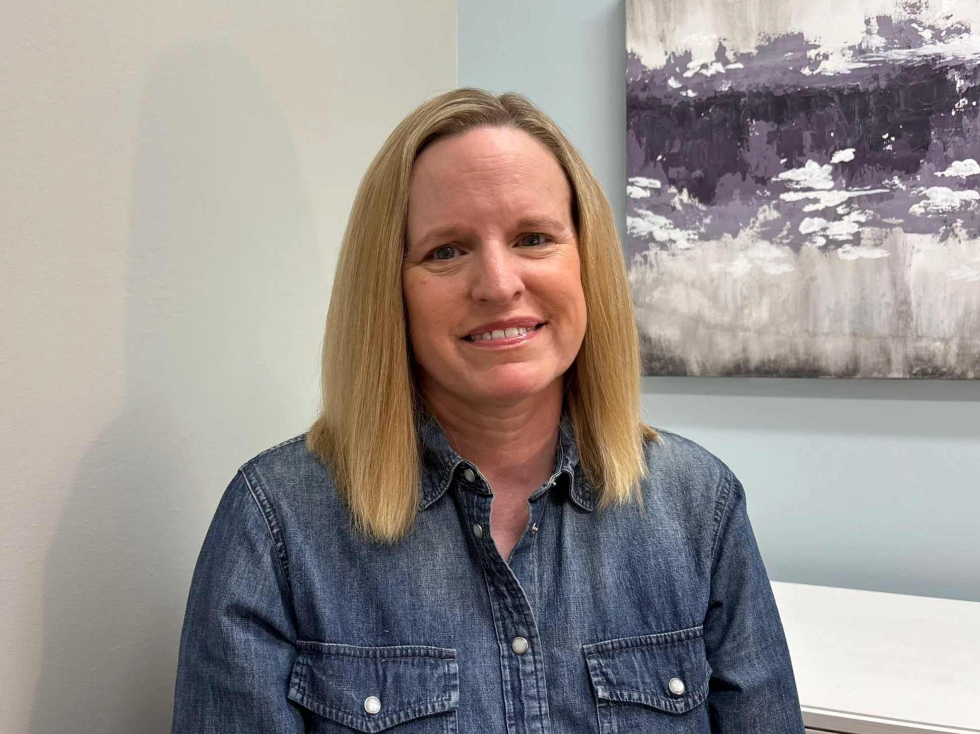 Mary Gamage - Therapist smiles at the camera