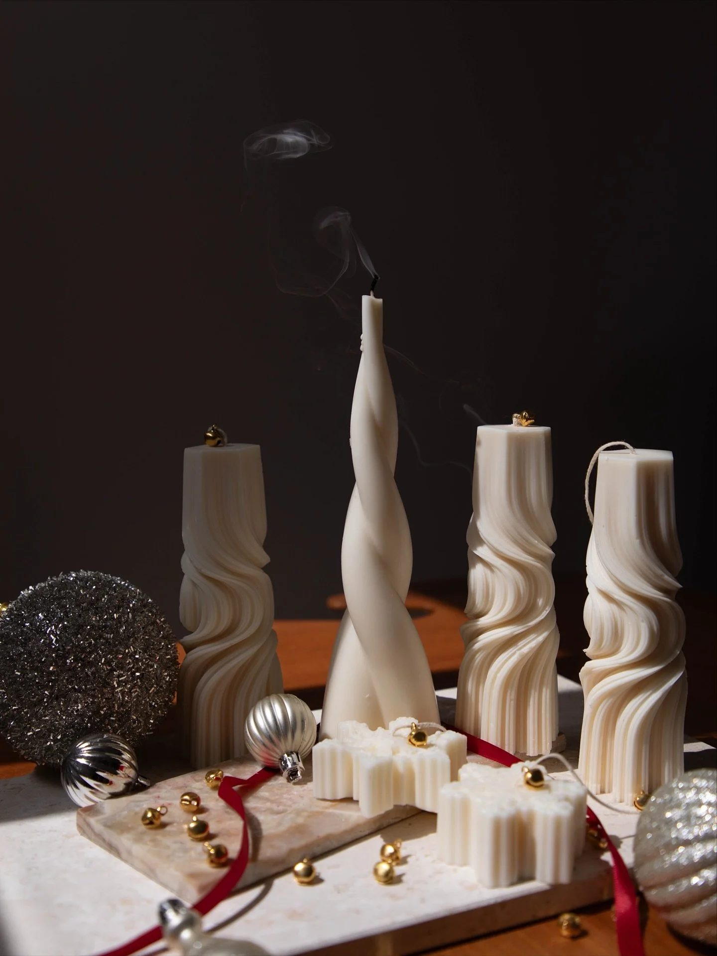 Christmas starts here: White candles, red ribbons, golden moments
&bull;
&bull;
 #holidayseason #luxurycandle #giftseason