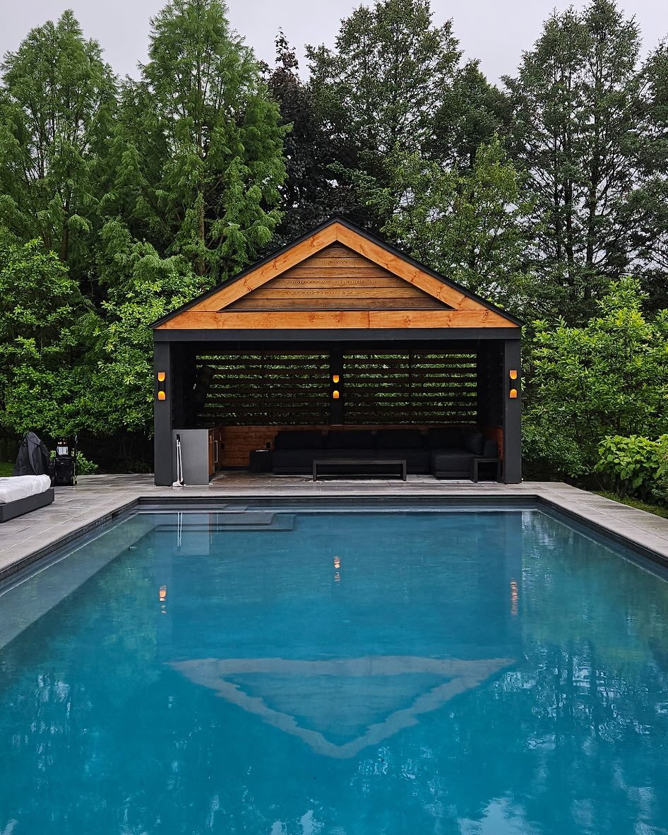 Despite the rainy weather, we&rsquo;re poolside! Here is the completed work in this Gladwyne pool house job, which included:
-building &amp; staining a new wall to match the remainder of the wood in the pool house 
-wiring electric for and installing