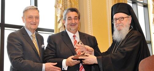 Archbishop Demetrios and Chairman Constantine G. Caras present Archbishop Iakovos Leadership 100 Award for Excellence to Ted Leonsis. (Fri-Leonsis-4)