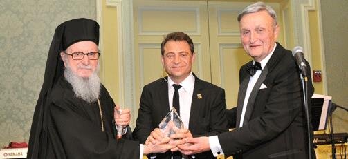 Archbishop Demetrios and Chairman Constantine G. Caras present Archbishop Iakovos Leadership 100 Award for Excellence to Dr. Peter Diamandis.