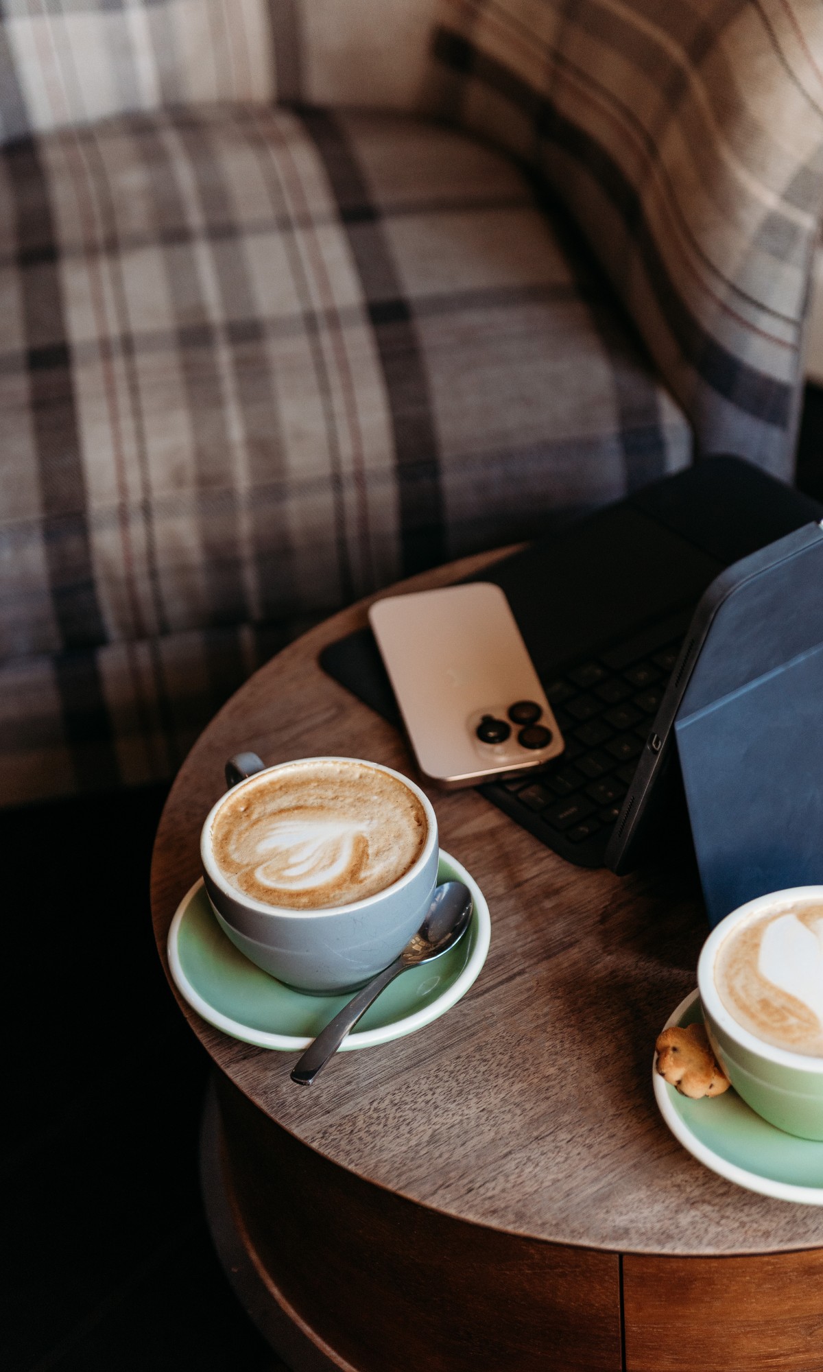 Coffee, notebook and laptop representing Espino Law's considered and practical approach
