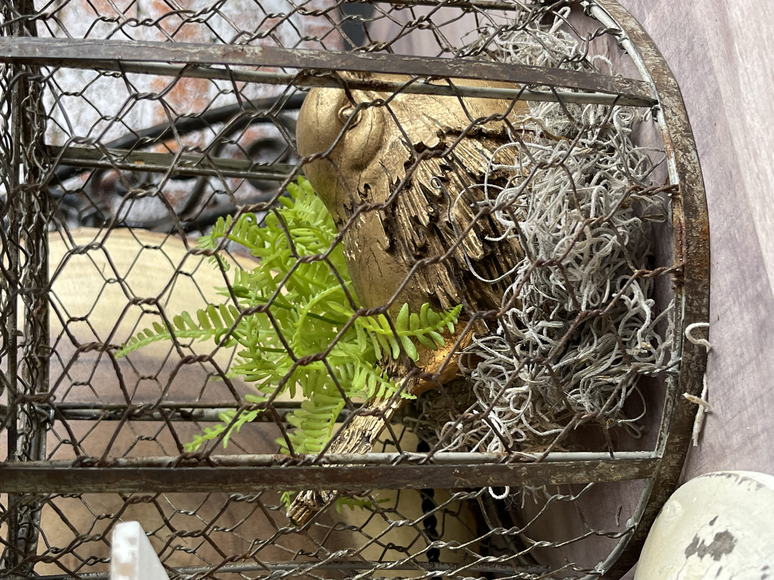 I styled it with a gold bird and a little nest I made out of Spanish moss and a little faux plant.