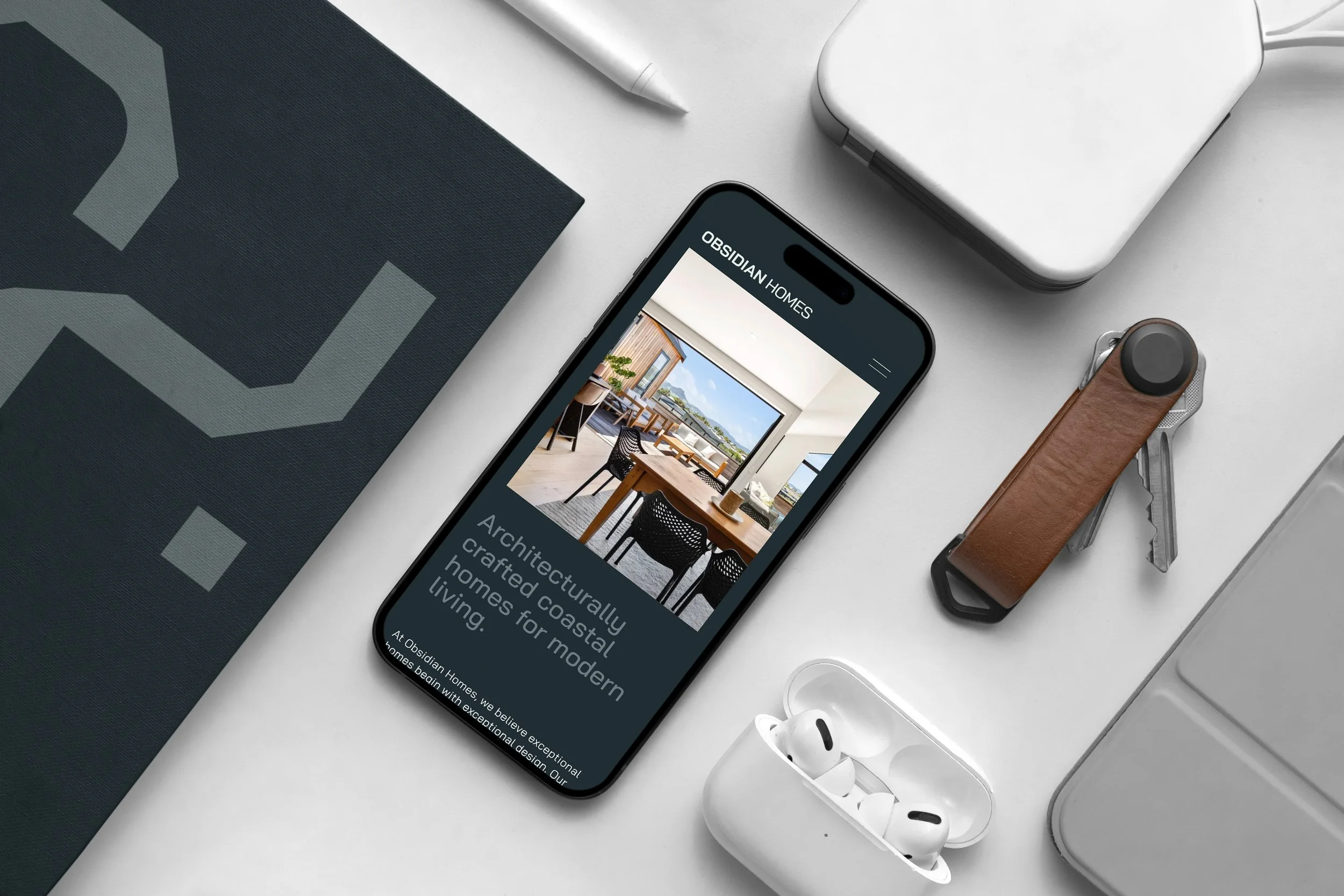 OH_iPhone Pro with Book Mockup.jpg