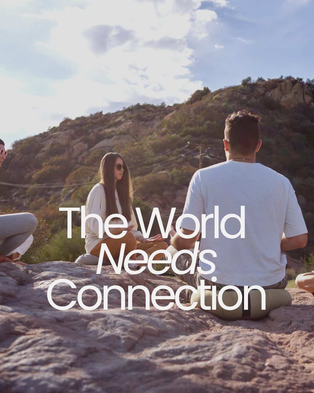People sat in a circle with the words The World Needs Connection