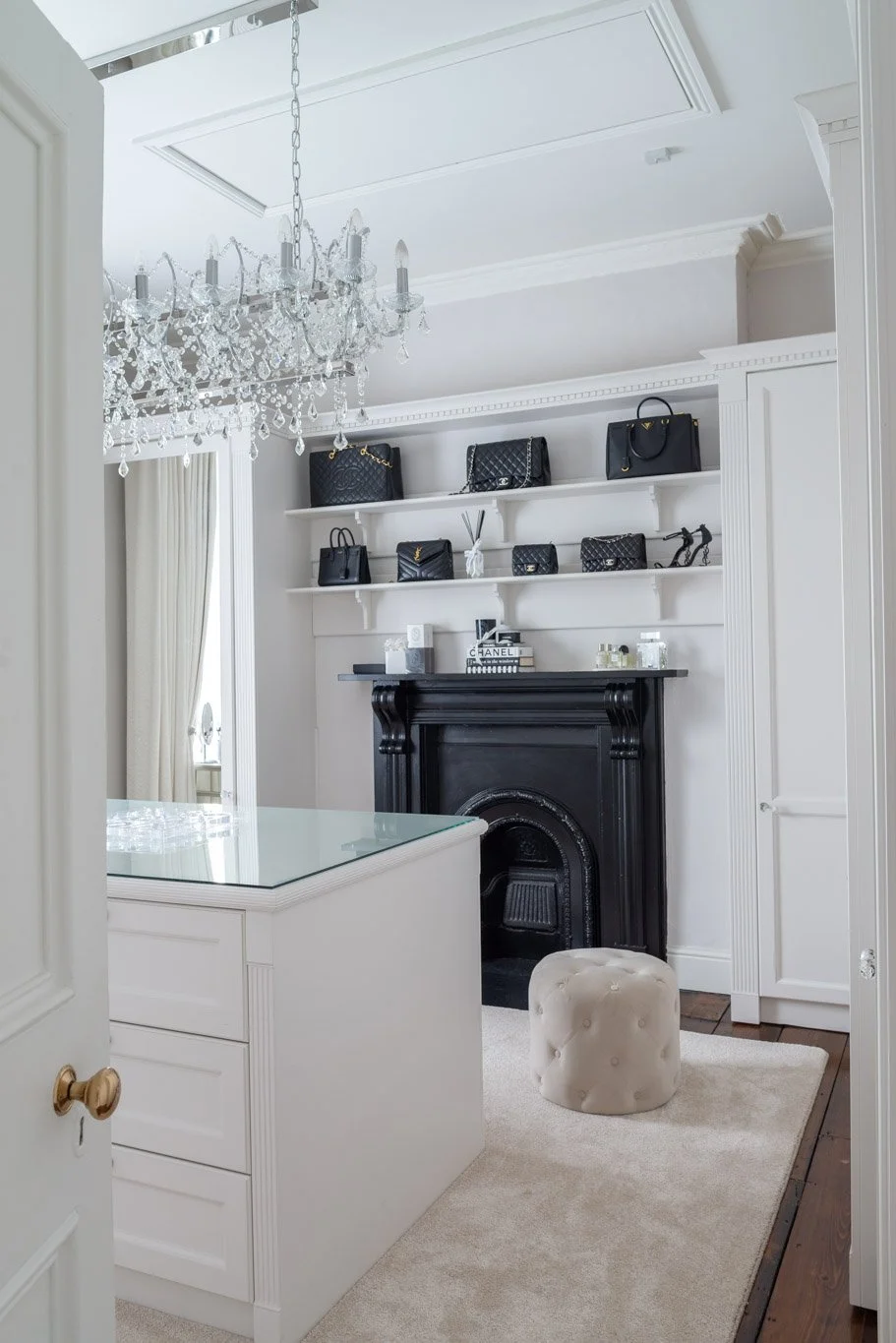 walk in wardrobe space with large hanging light