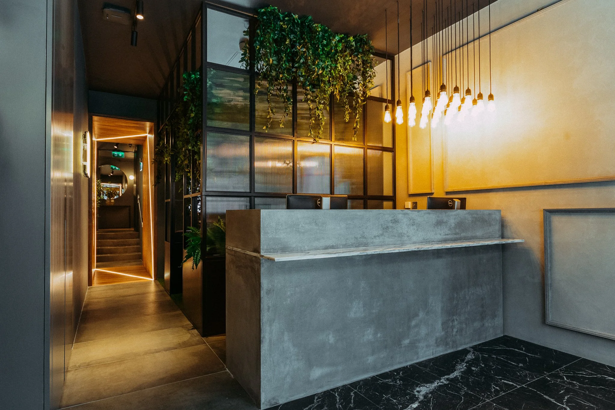 industrial designed concrete reception area of beauticians