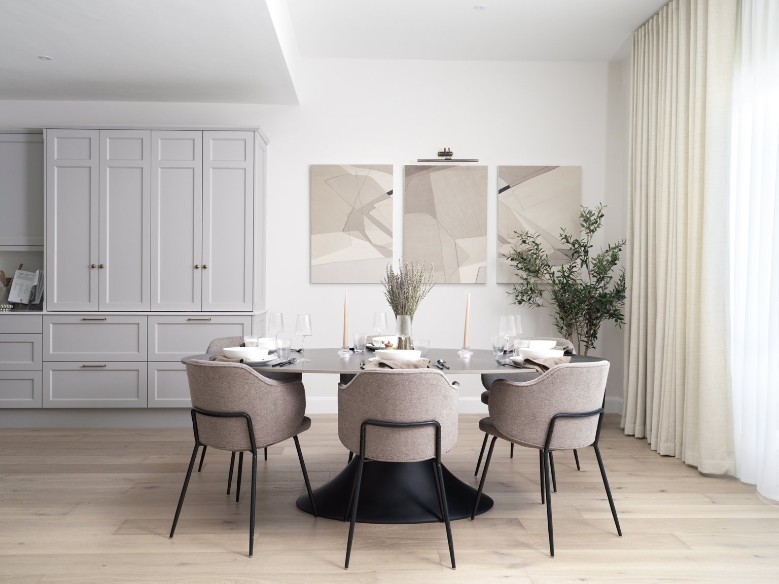 bright airy dining kitchen area with cream drapes