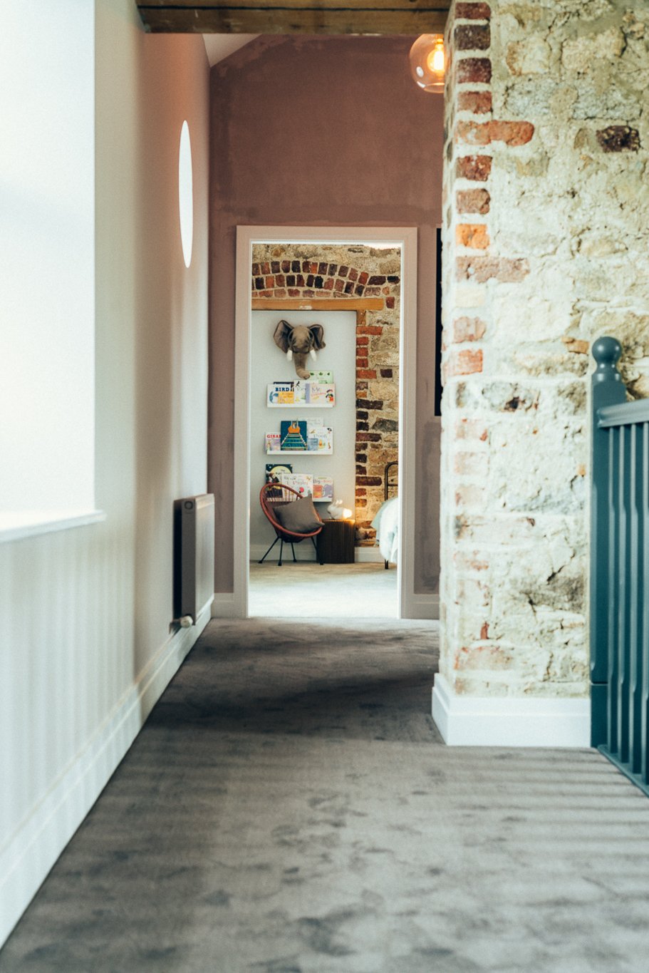 brick bedroom wall and hallway
