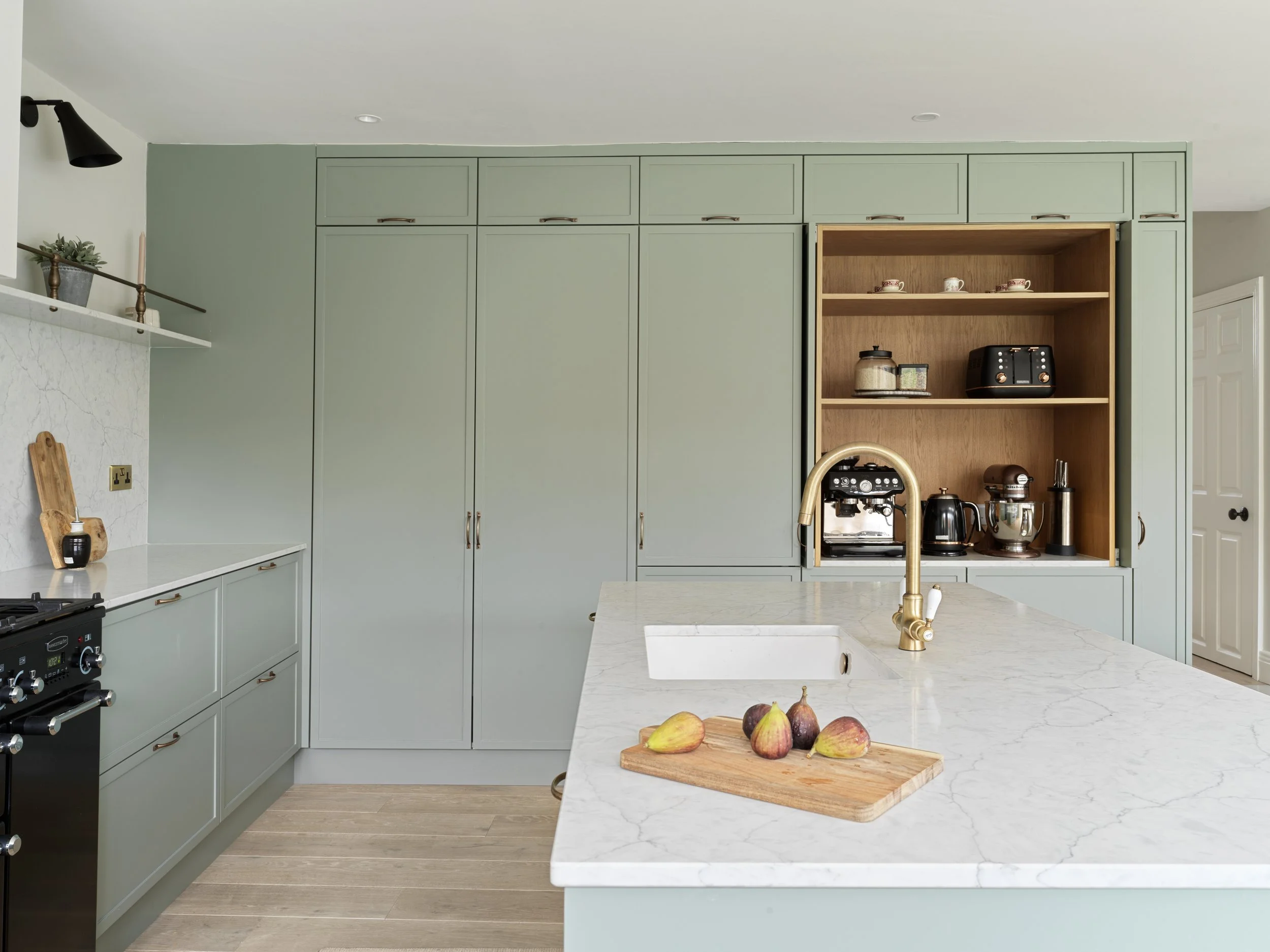 hidden coffee dock in sage green kitchen