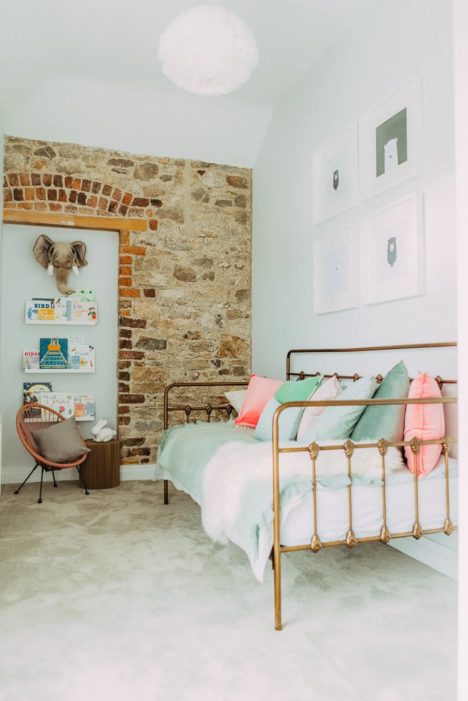 Childs bedroom with brick wall